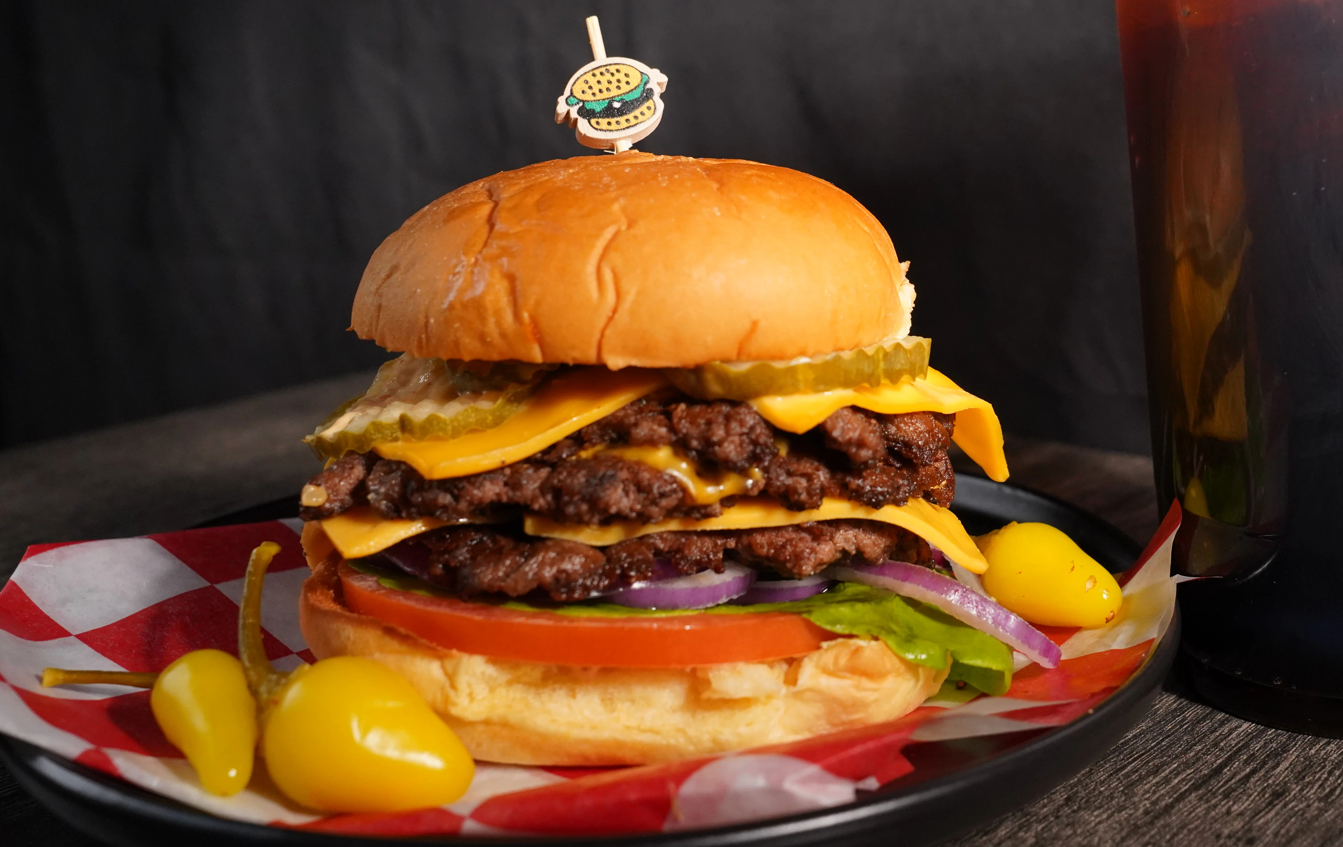 Juicy cheeseburger with multiple patties and toppings