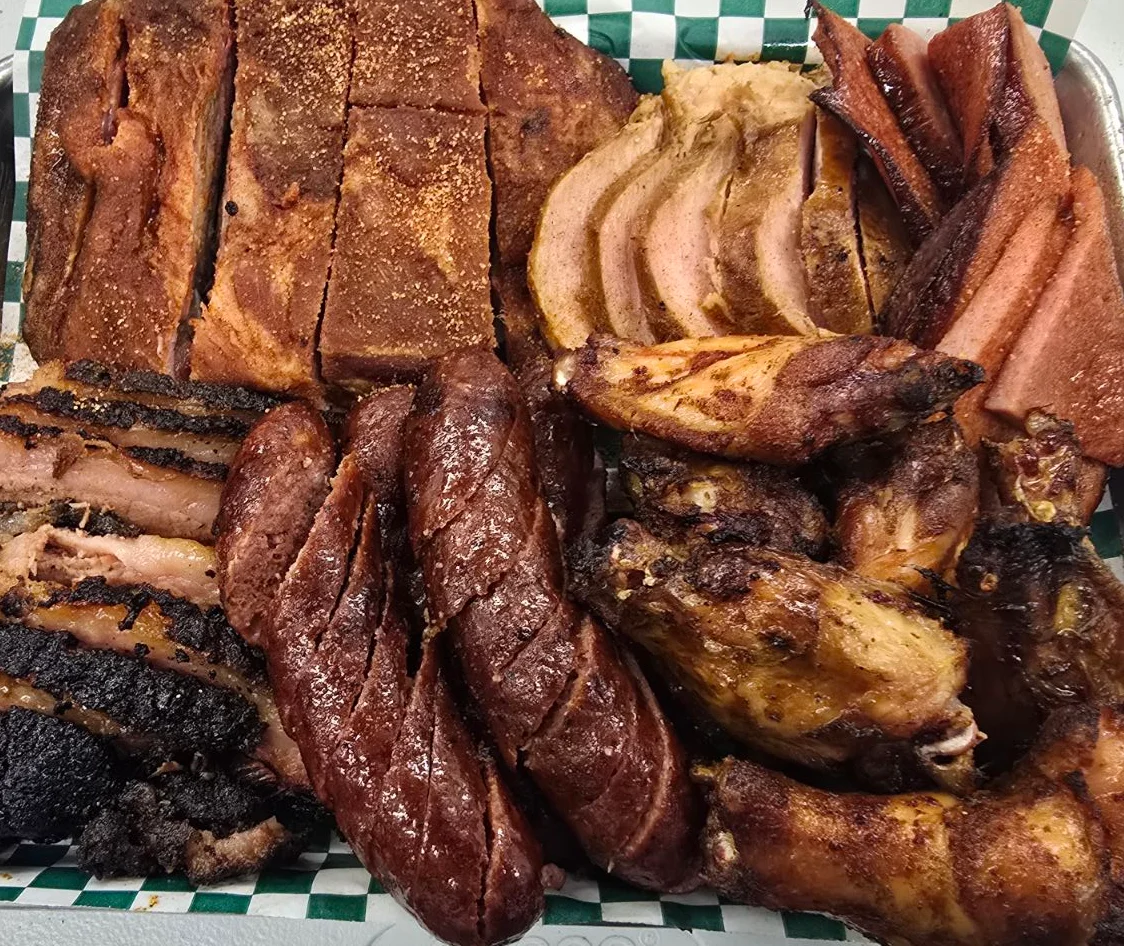 Assorted barbecue platter featuring smoked meats