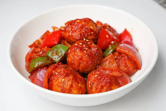 Nigerian peppered meatballs with peppers and onions