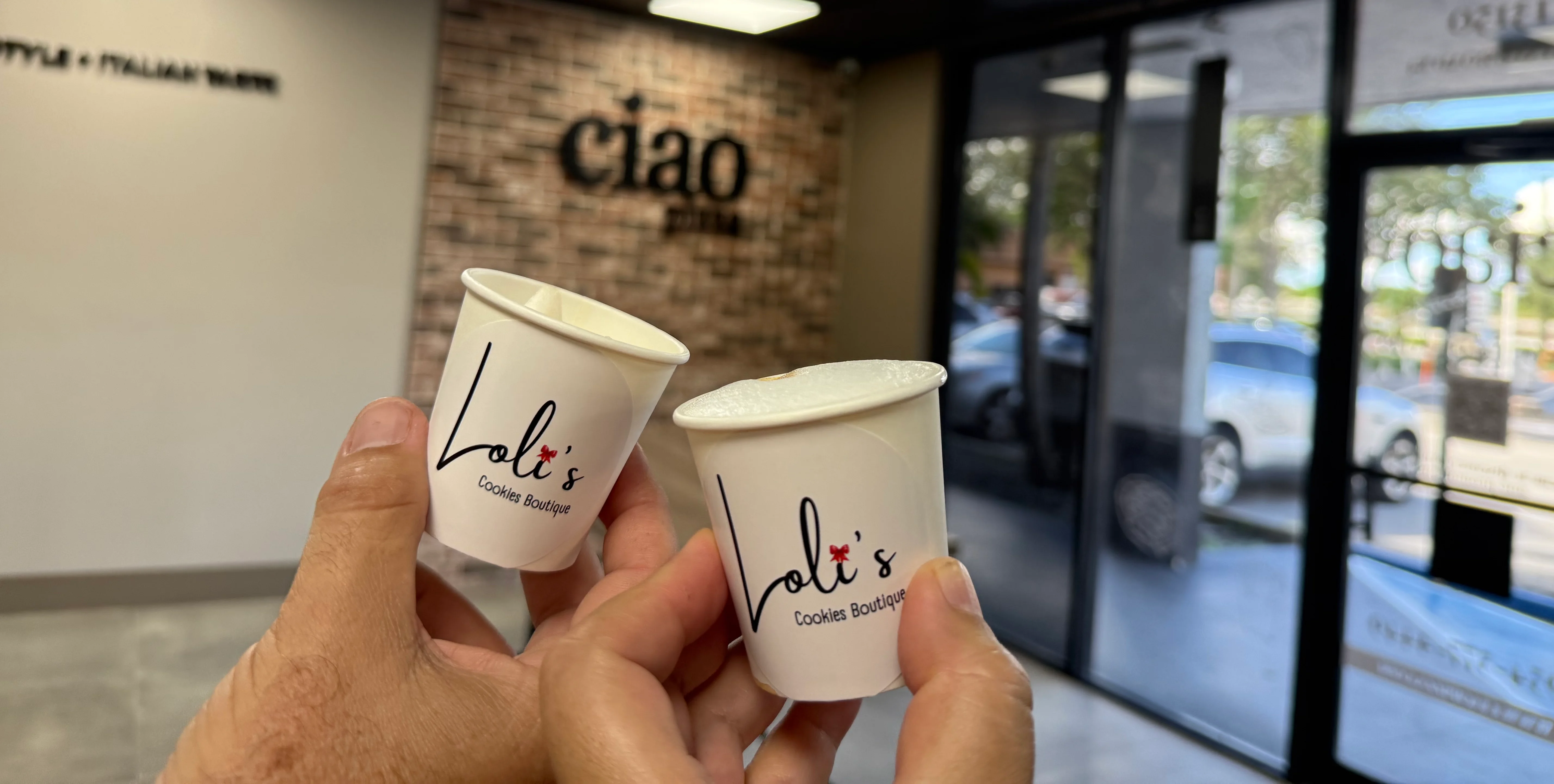 Cheers with Loli's cookie cups in a cozy boutique setting