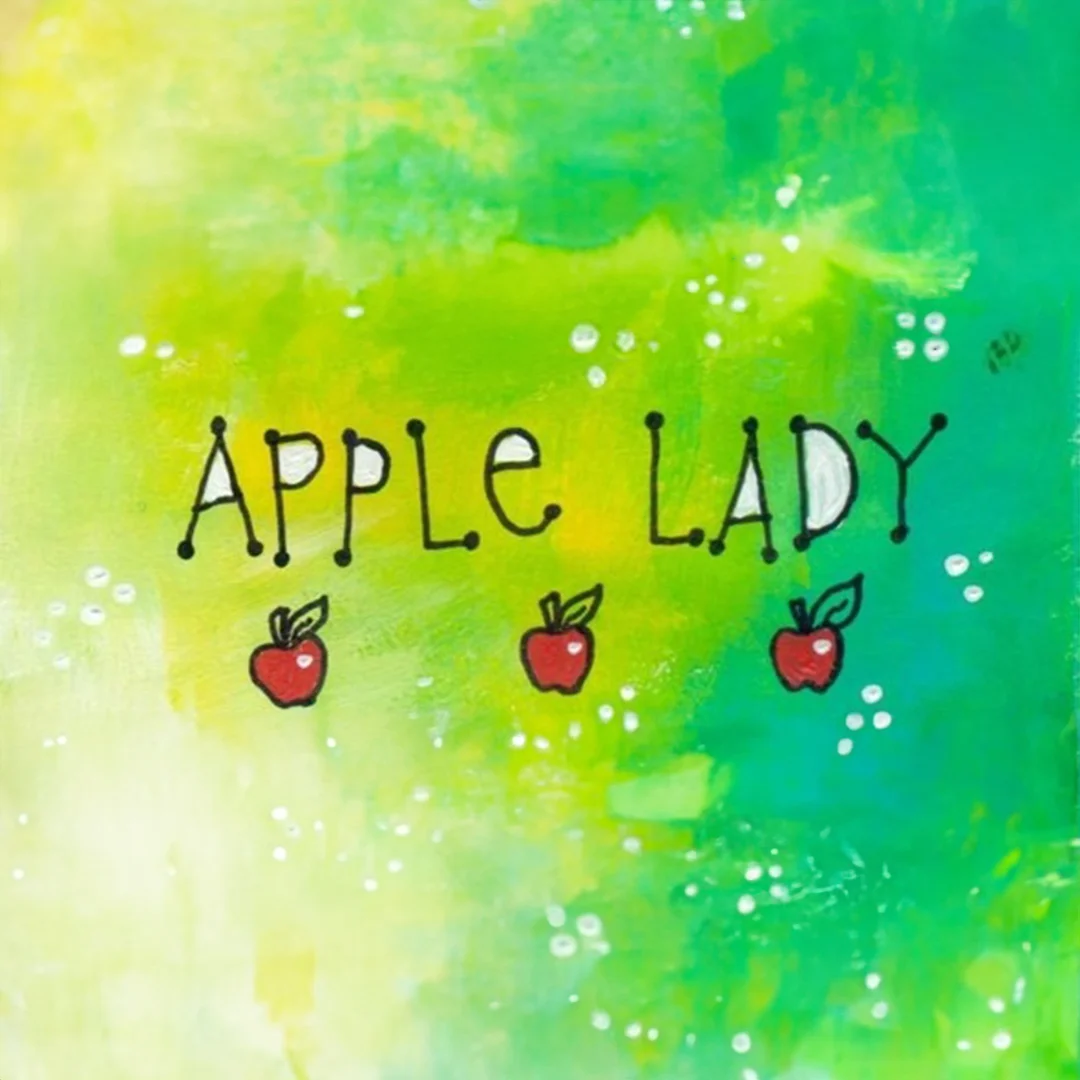 Colorful artwork featuring the phrase 'Apple Lady' with apple illustrations