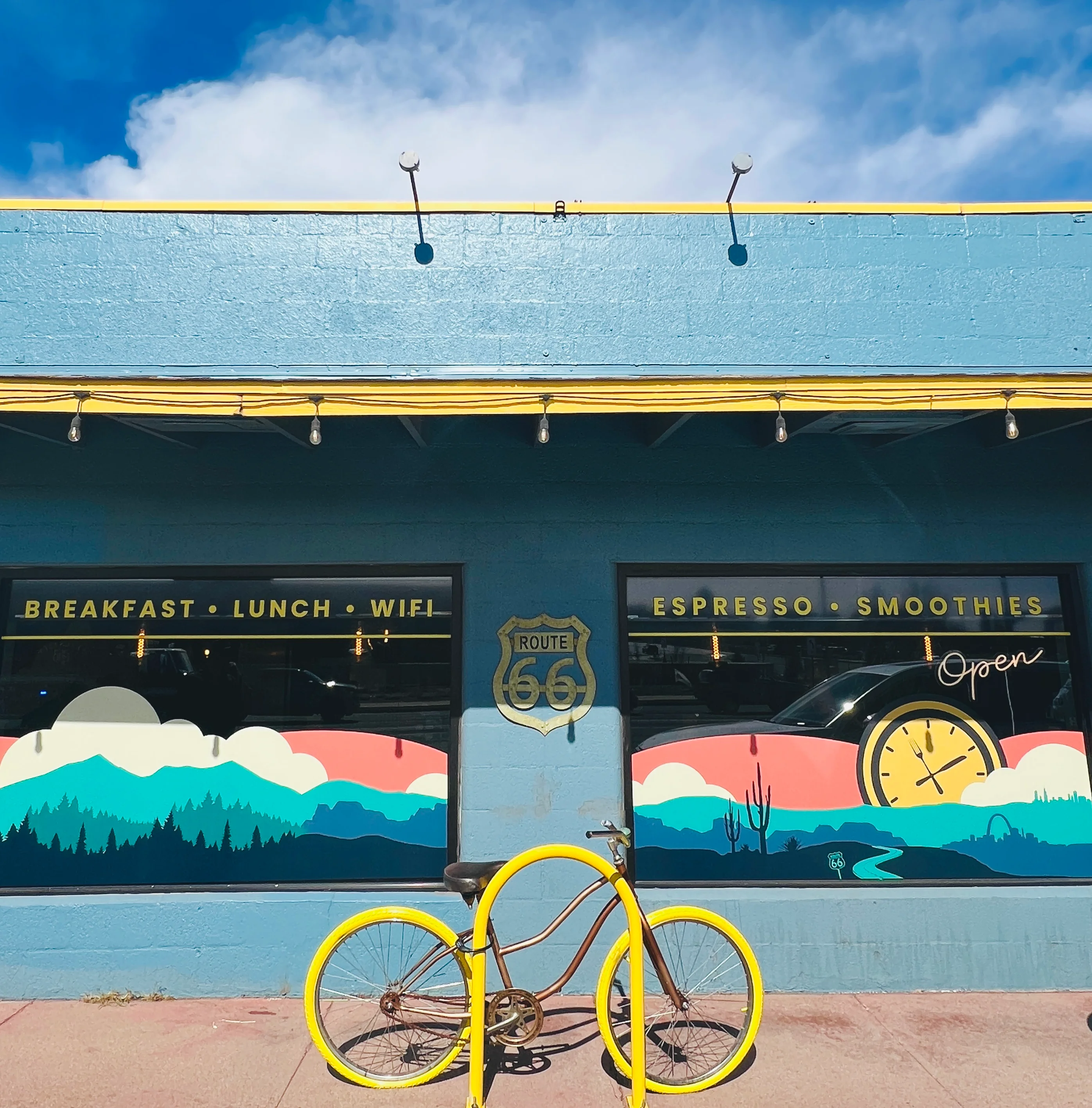 Colorful cafe exterior with bicycle and Route 66 theme