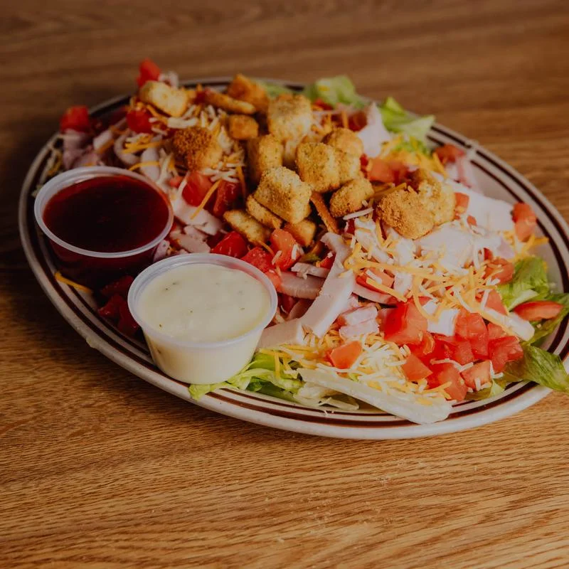Fresh garden salad with turkey and croutons