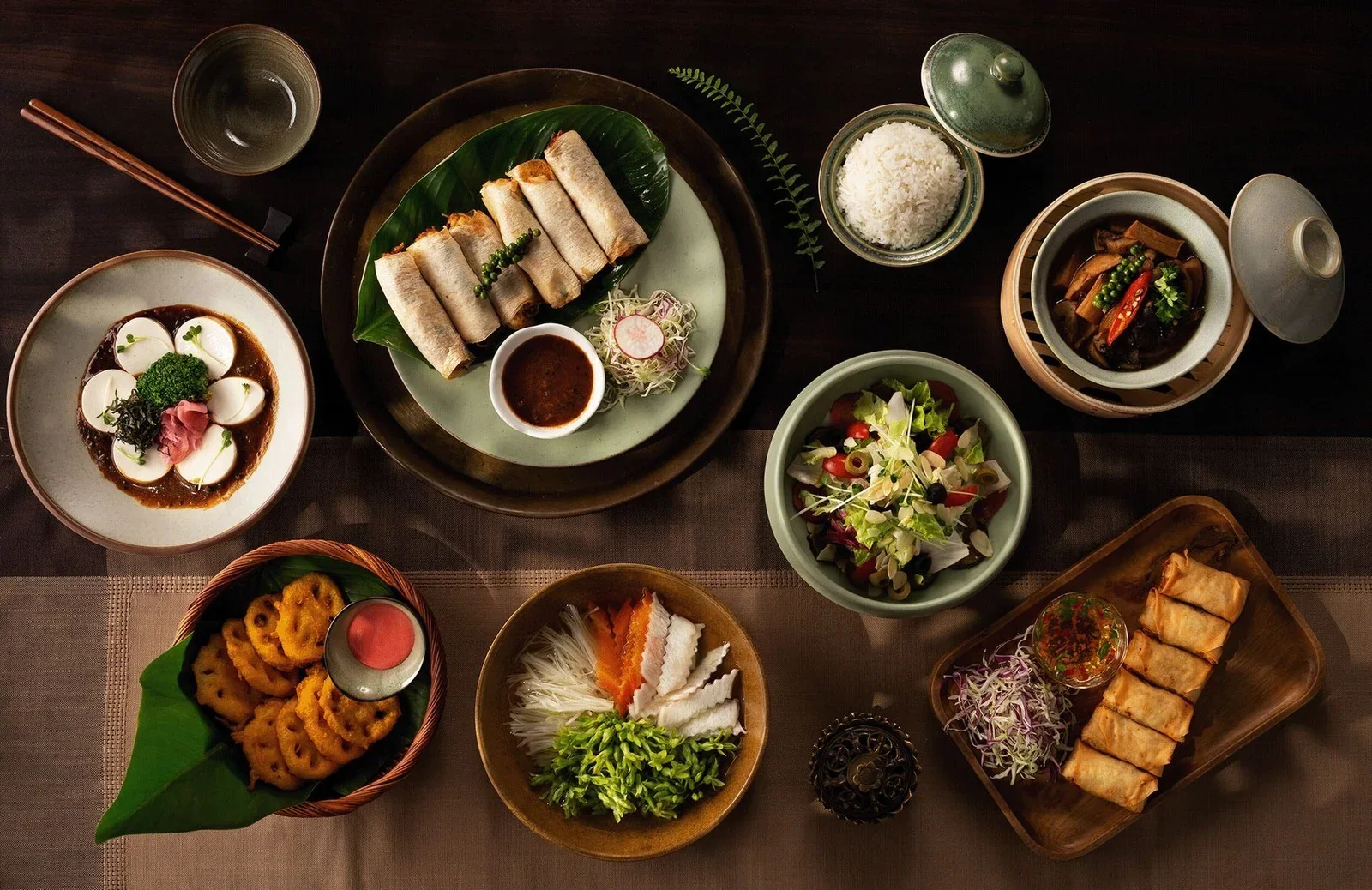 Assorted Vietnamese dishes including spring rolls and rice