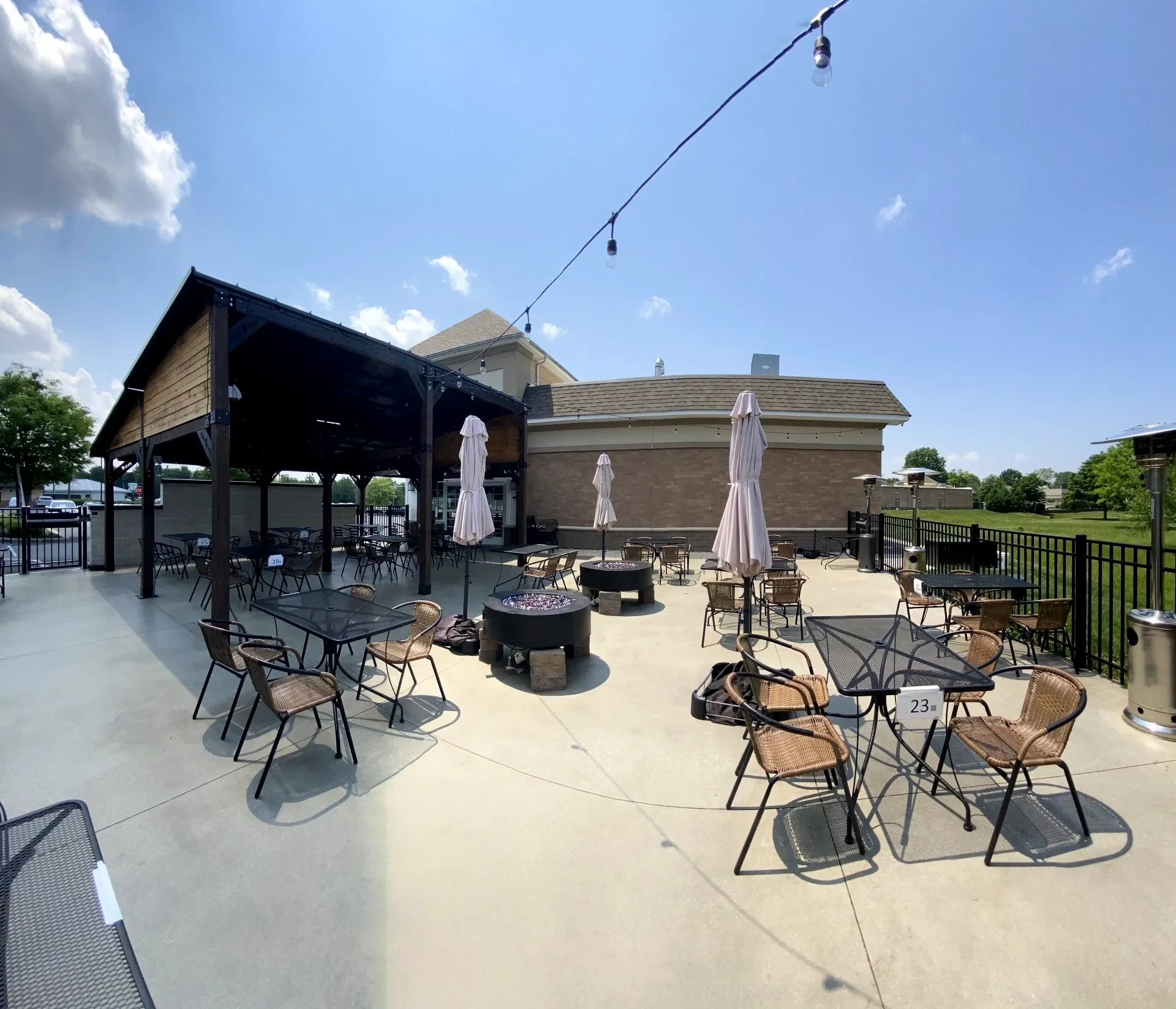 Outdoor dining area with tables and umbrellas