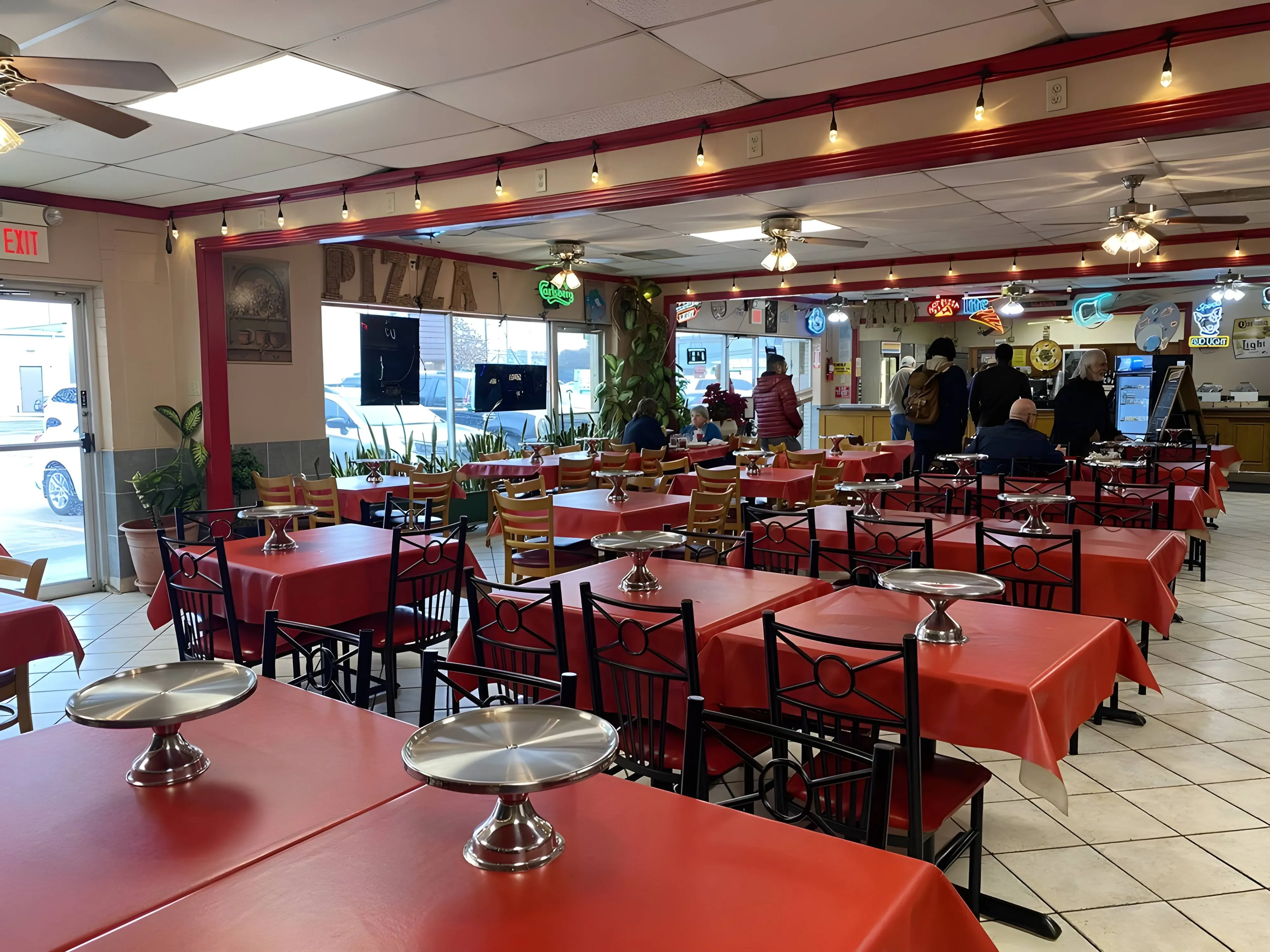 Cozy restaurant interior with red tablecloths and vibrant decor