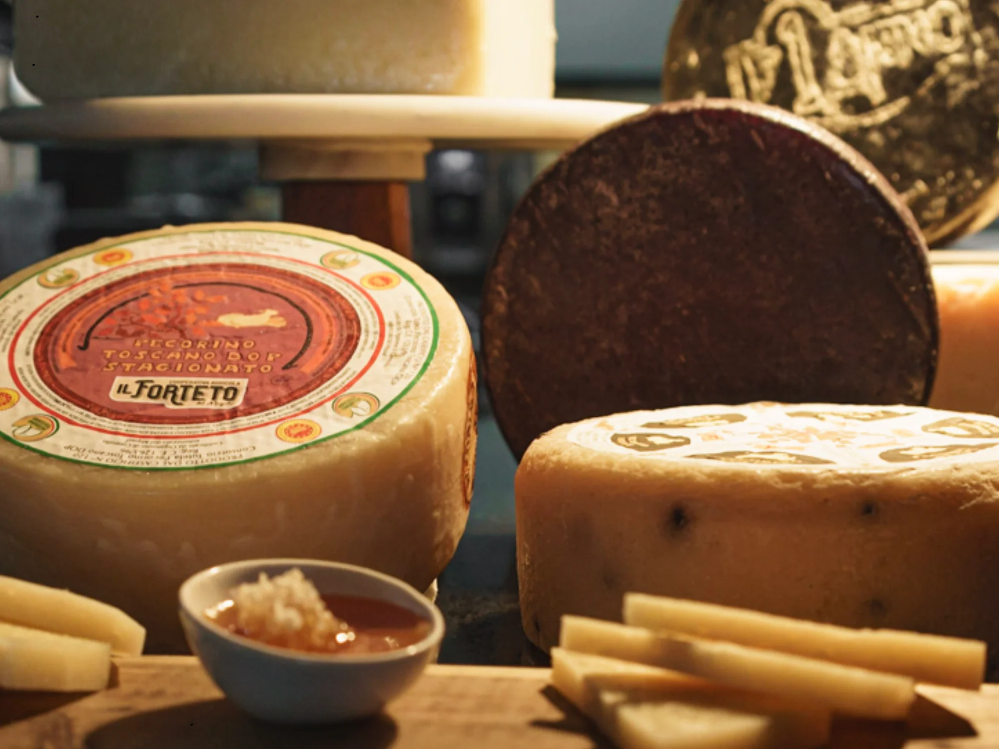 Artisan Italian cheeses including Pecorino Toscano
