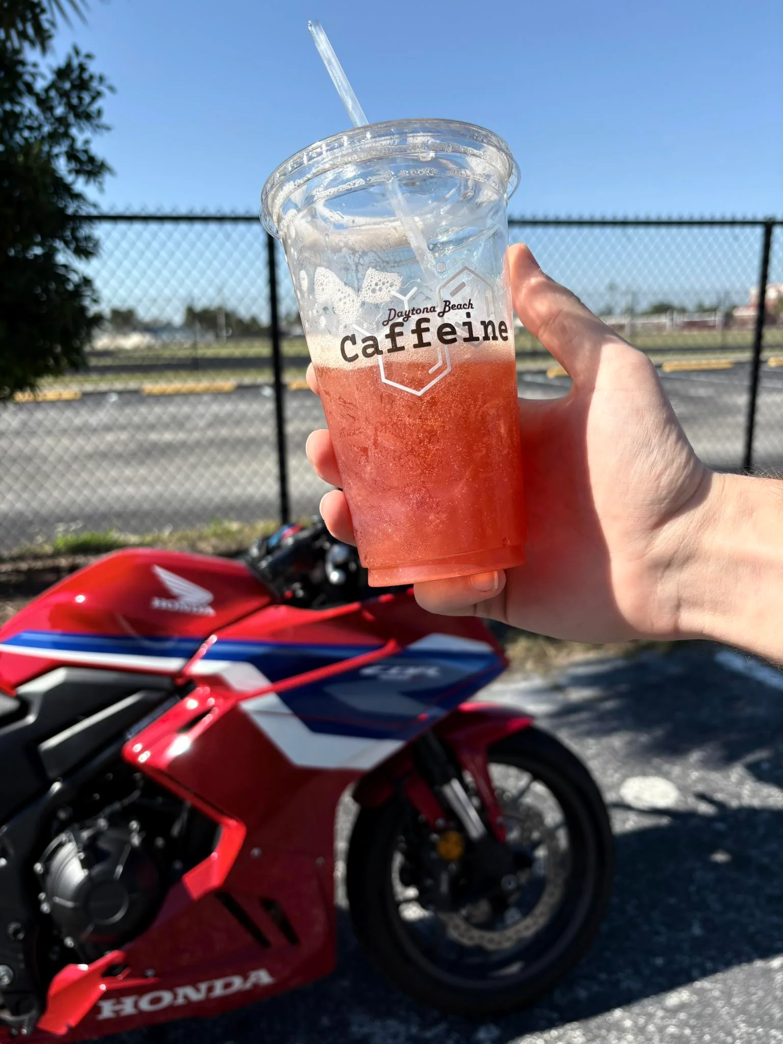 Refreshing drink from Daytona Beach Caffeine with a motorcycle in the background