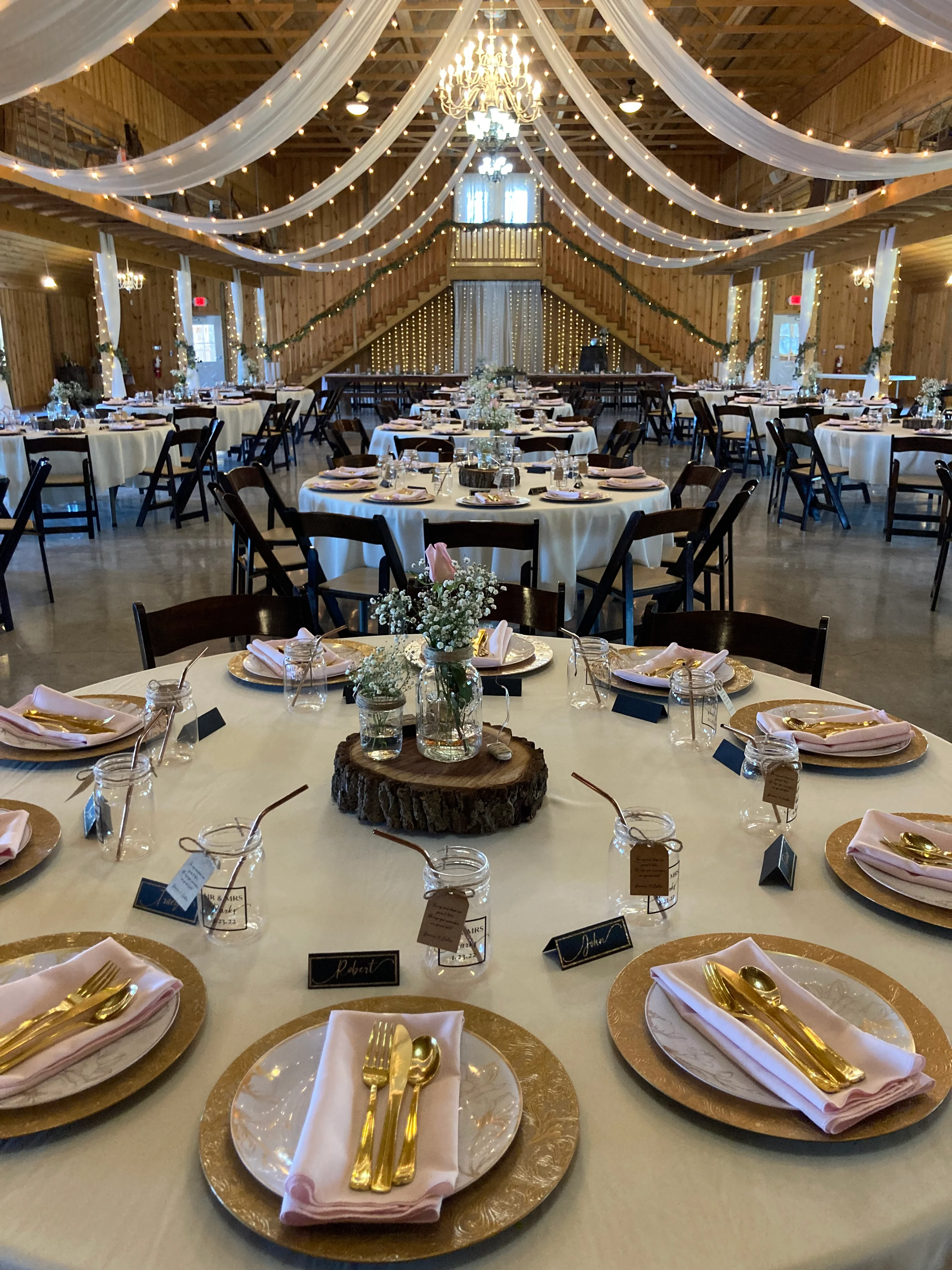 Elegant wedding reception setup with tables and decor