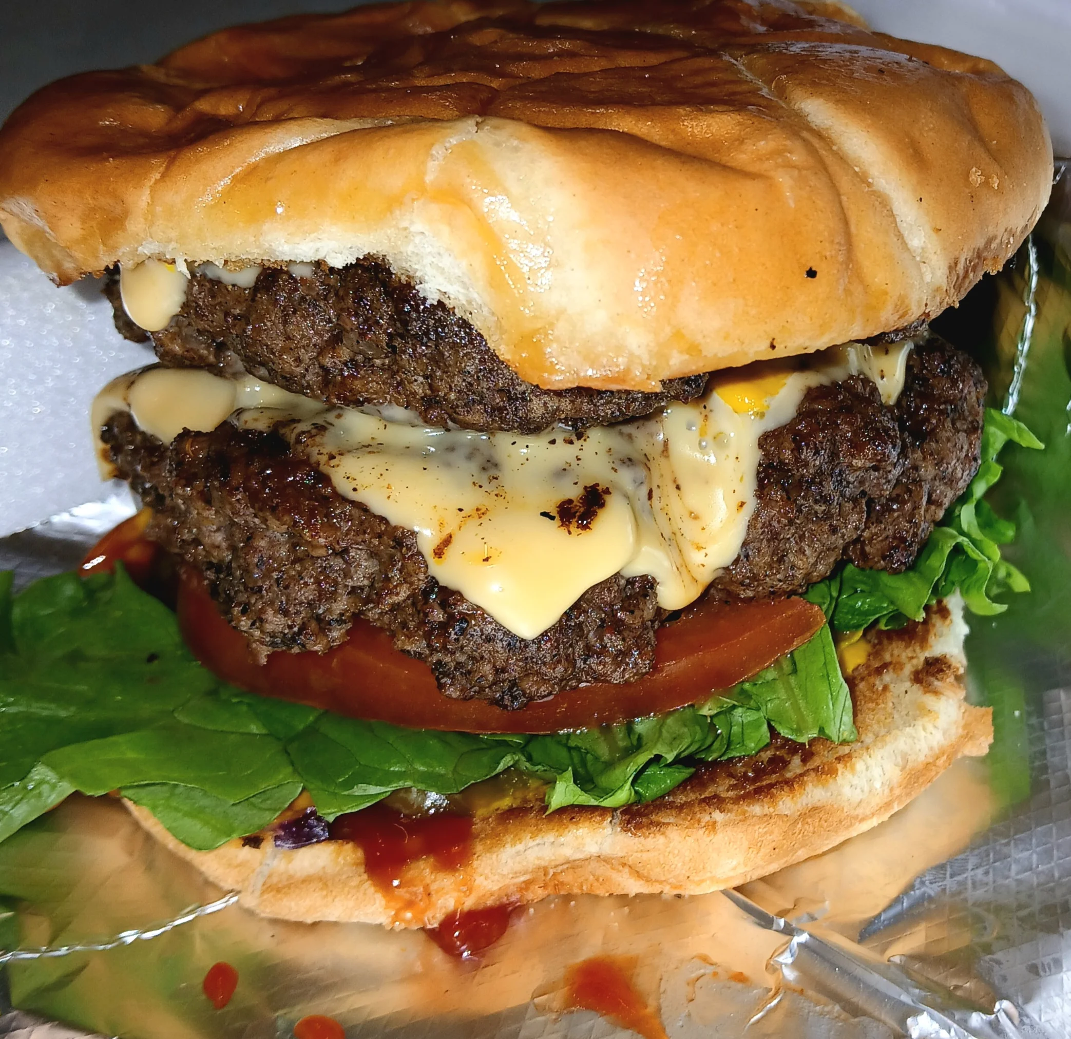 Double cheeseburger with lettuce and tomato