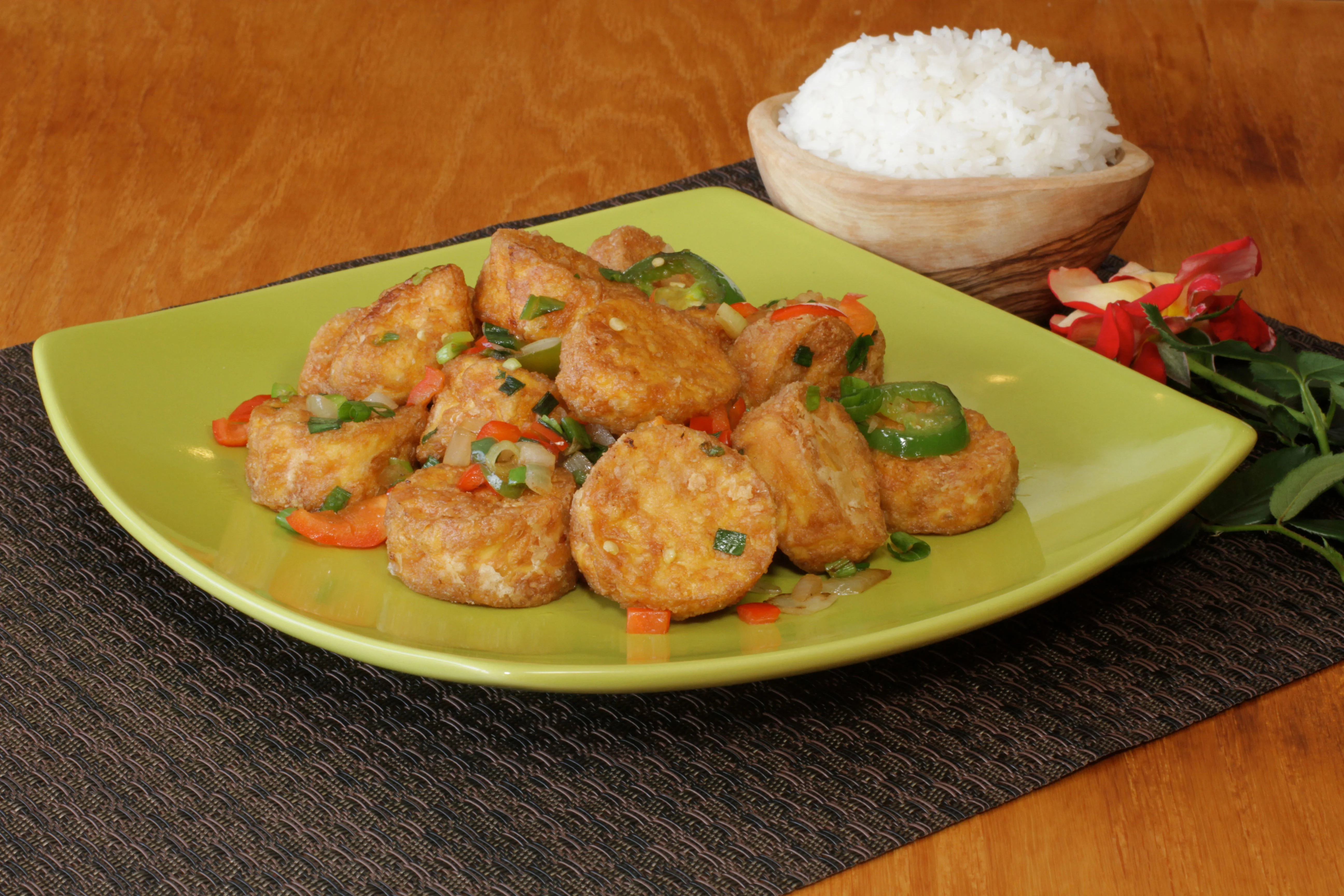 Fried Nigerian yam balls served with vegetables
