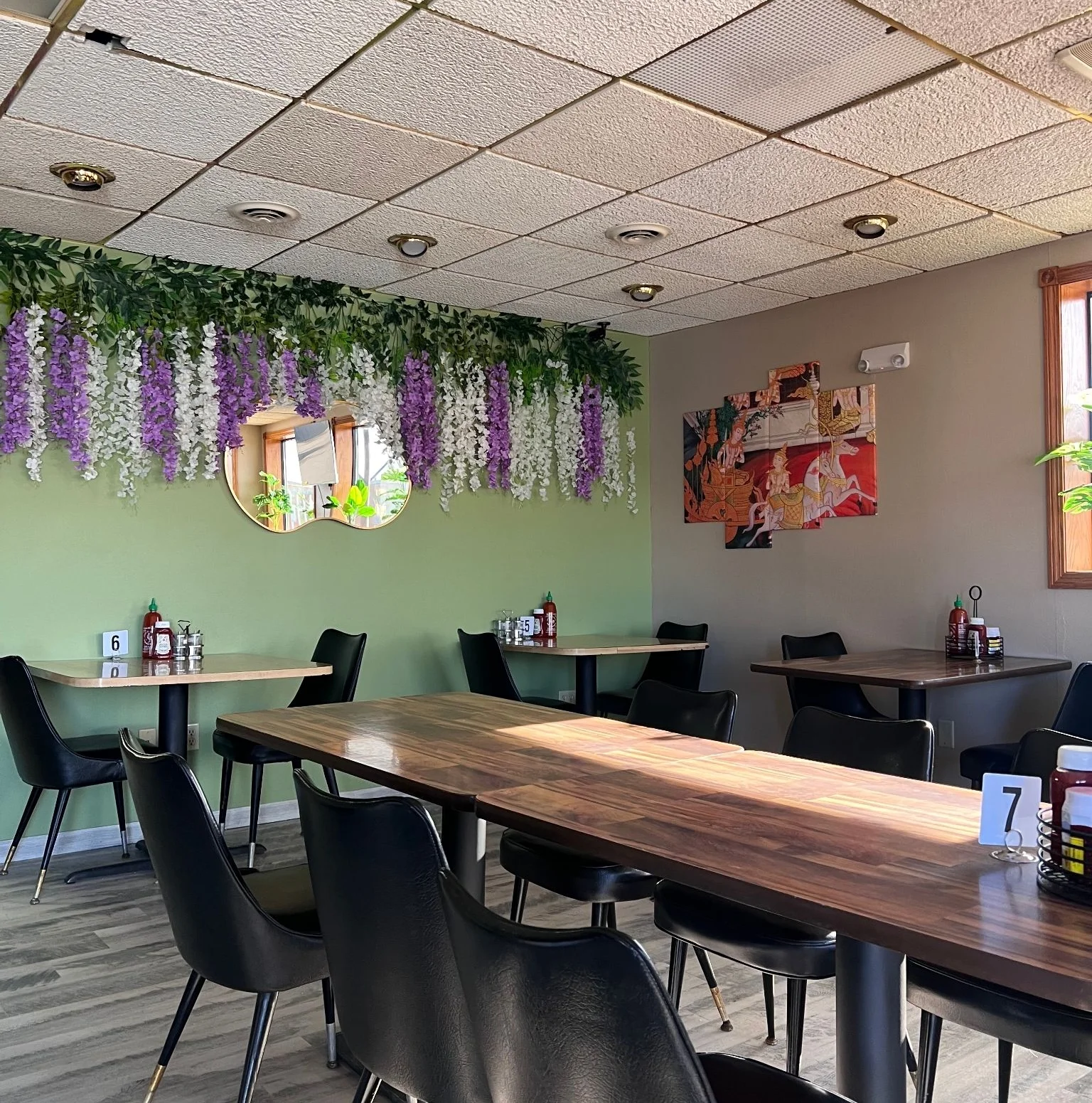 Cozy restaurant interior with floral decor and modern seating