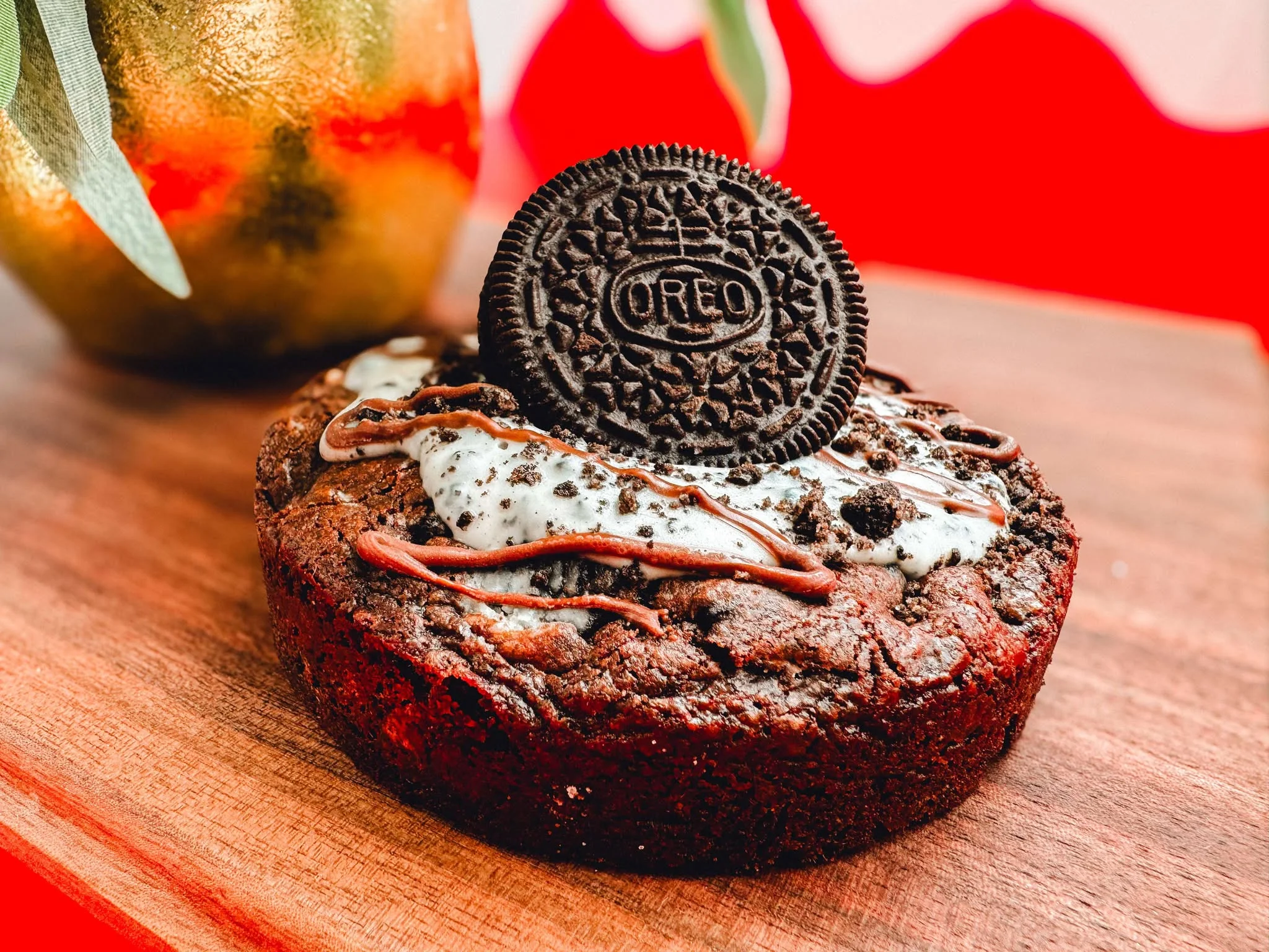 Decadent brownie topped with Oreo and cream