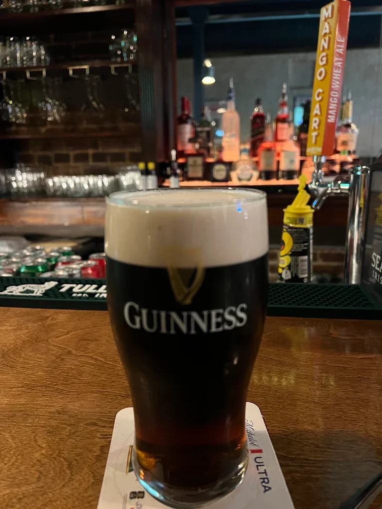 Pint of Guinness beer on a bar counter