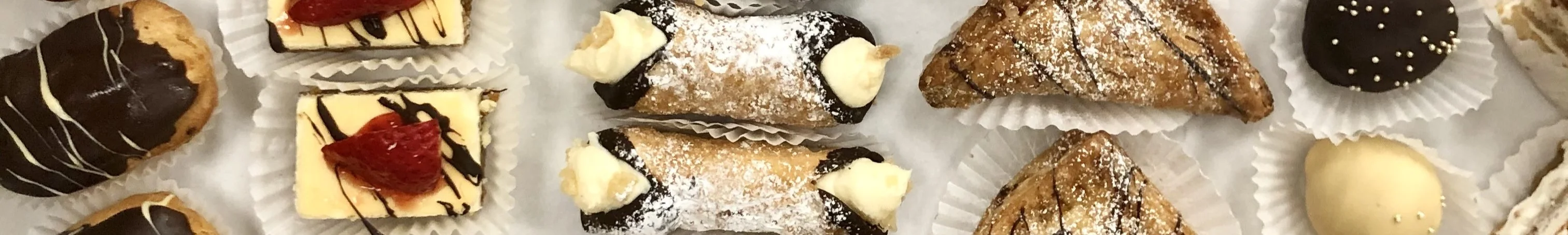 Assorted Italian pastries including cannoli and biscotti