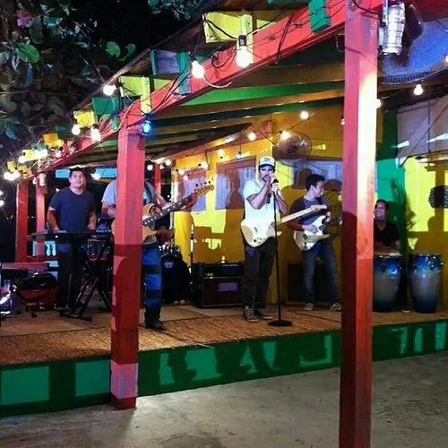 Live band performing at a vibrant outdoor restaurant stage
