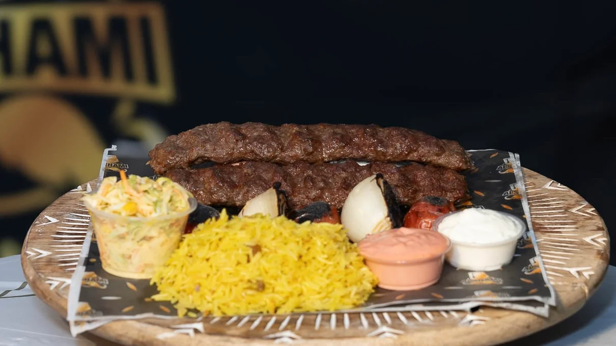 Delicious Persian kebab platter with saffron rice and grilled vegetables