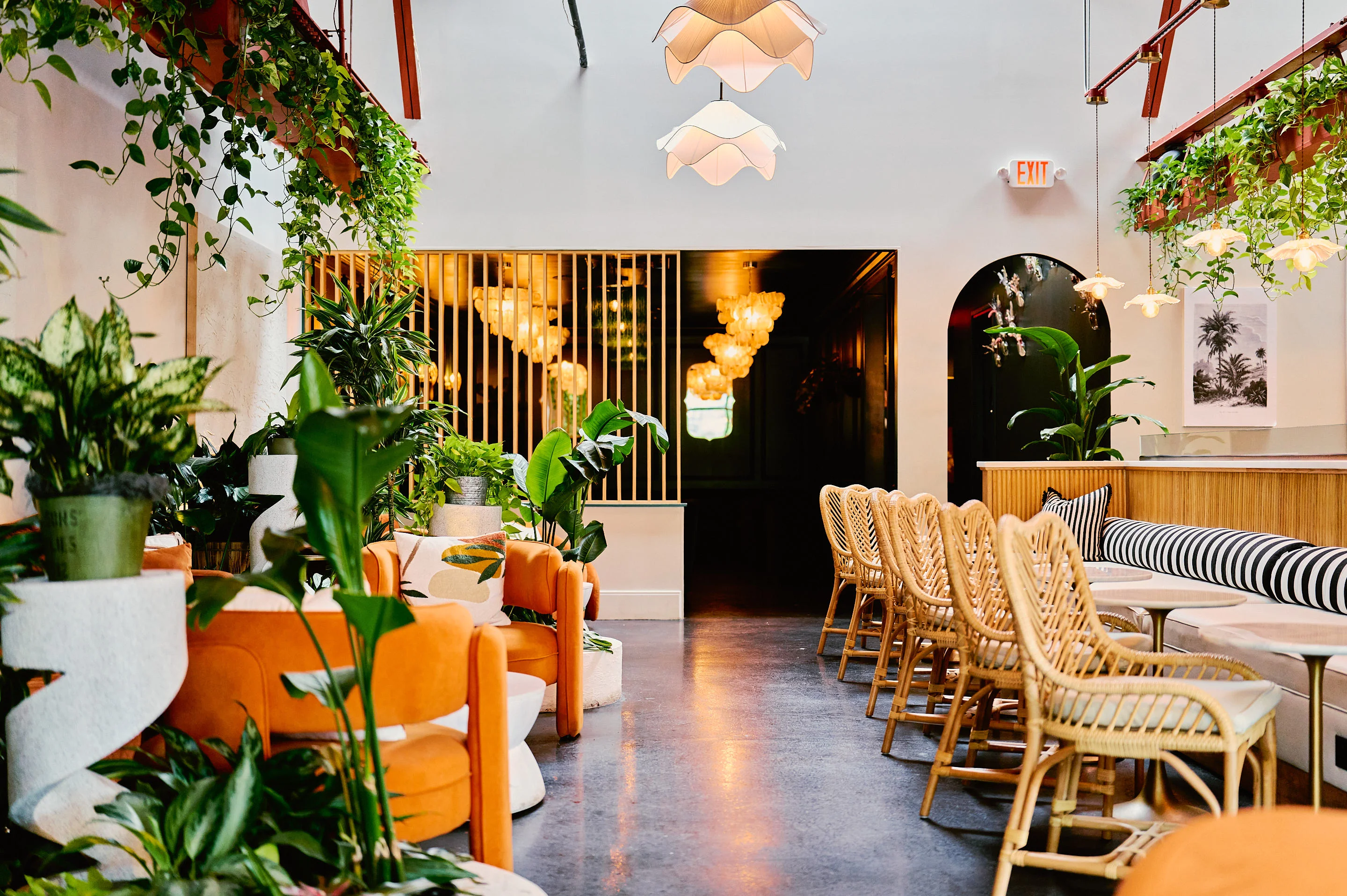Stylish restaurant interior with greenery and modern decor