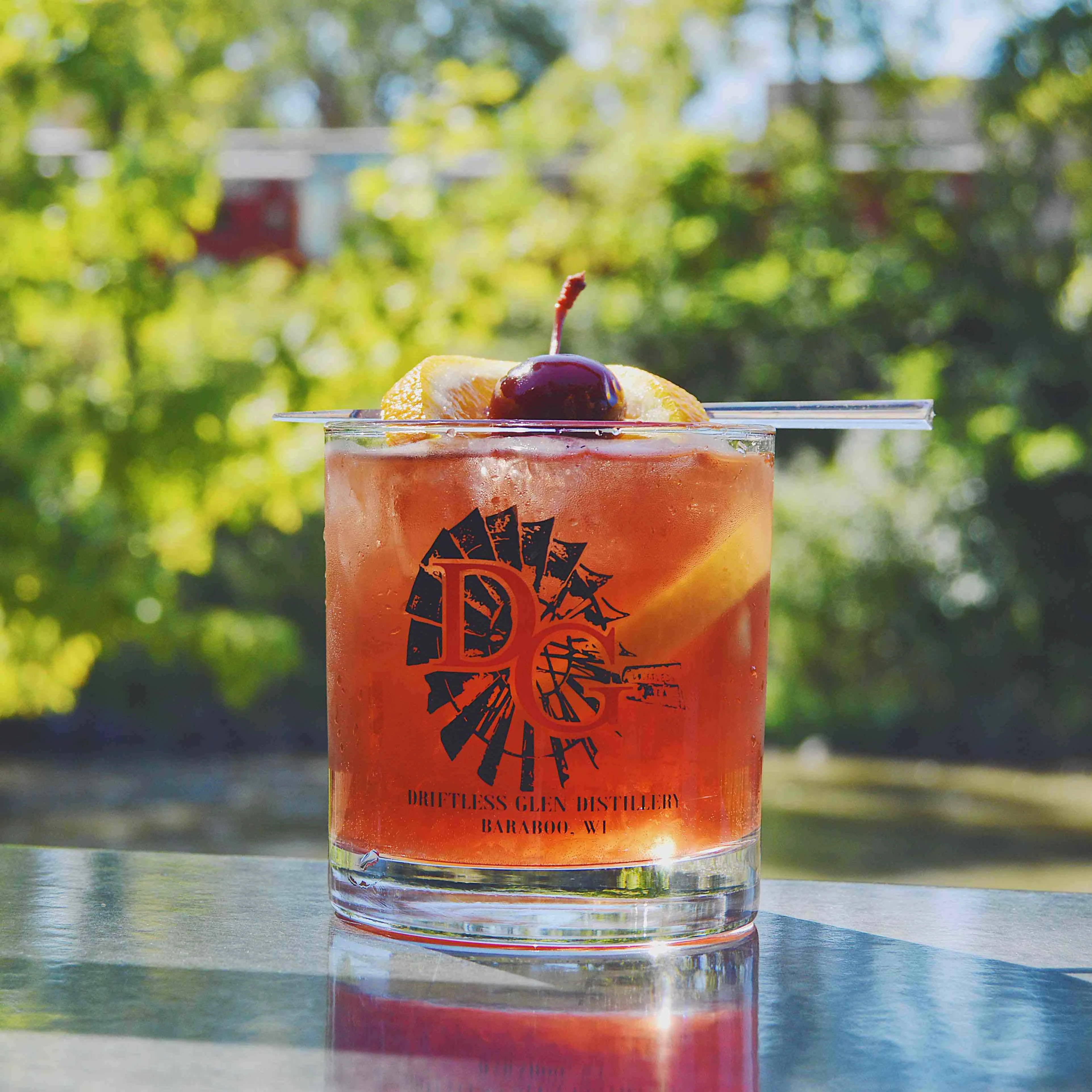 Driftless Old Fashioned sitting outside on a sunny patio at Driftless Glen