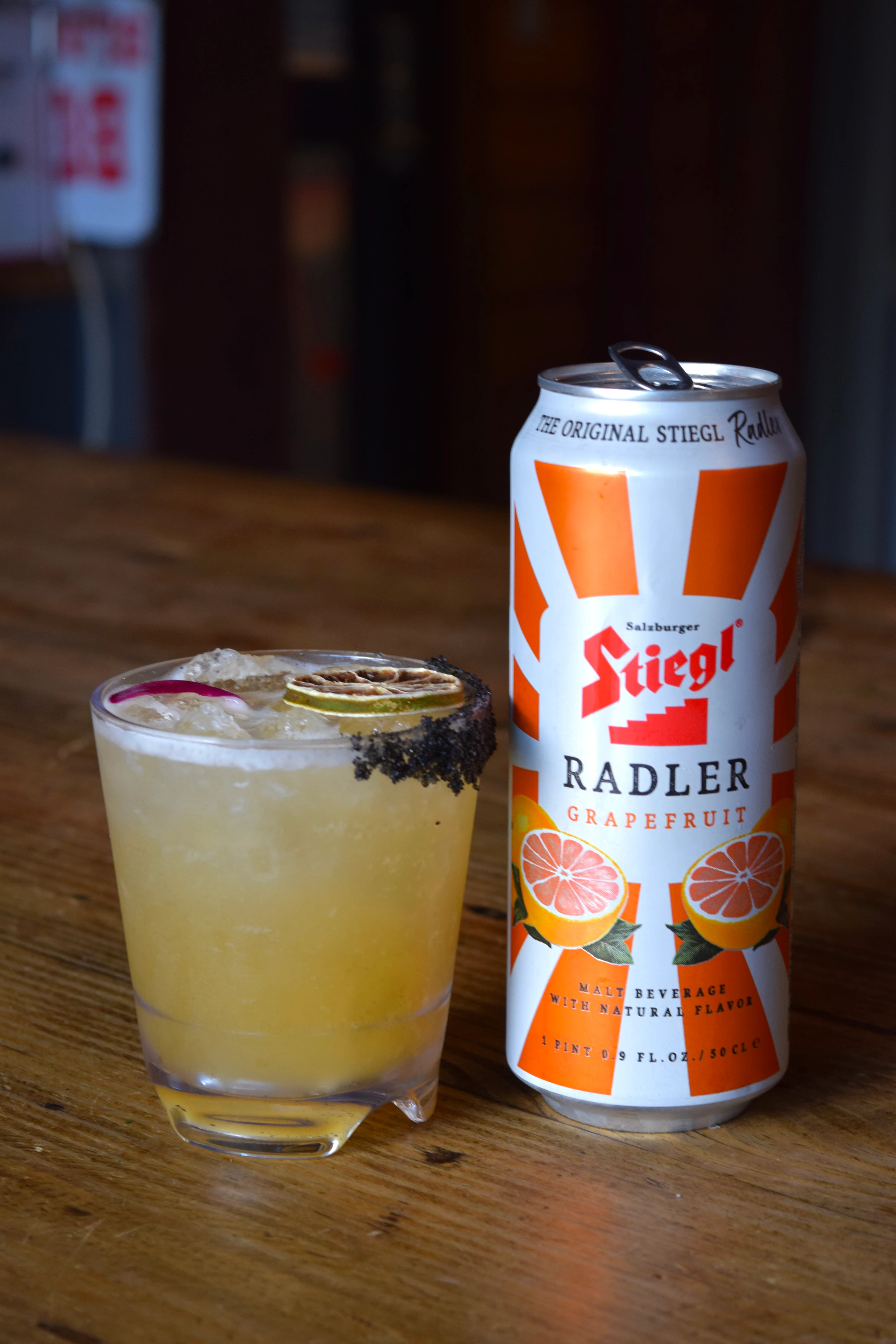 Refreshing grapefruit radler cocktail with a can