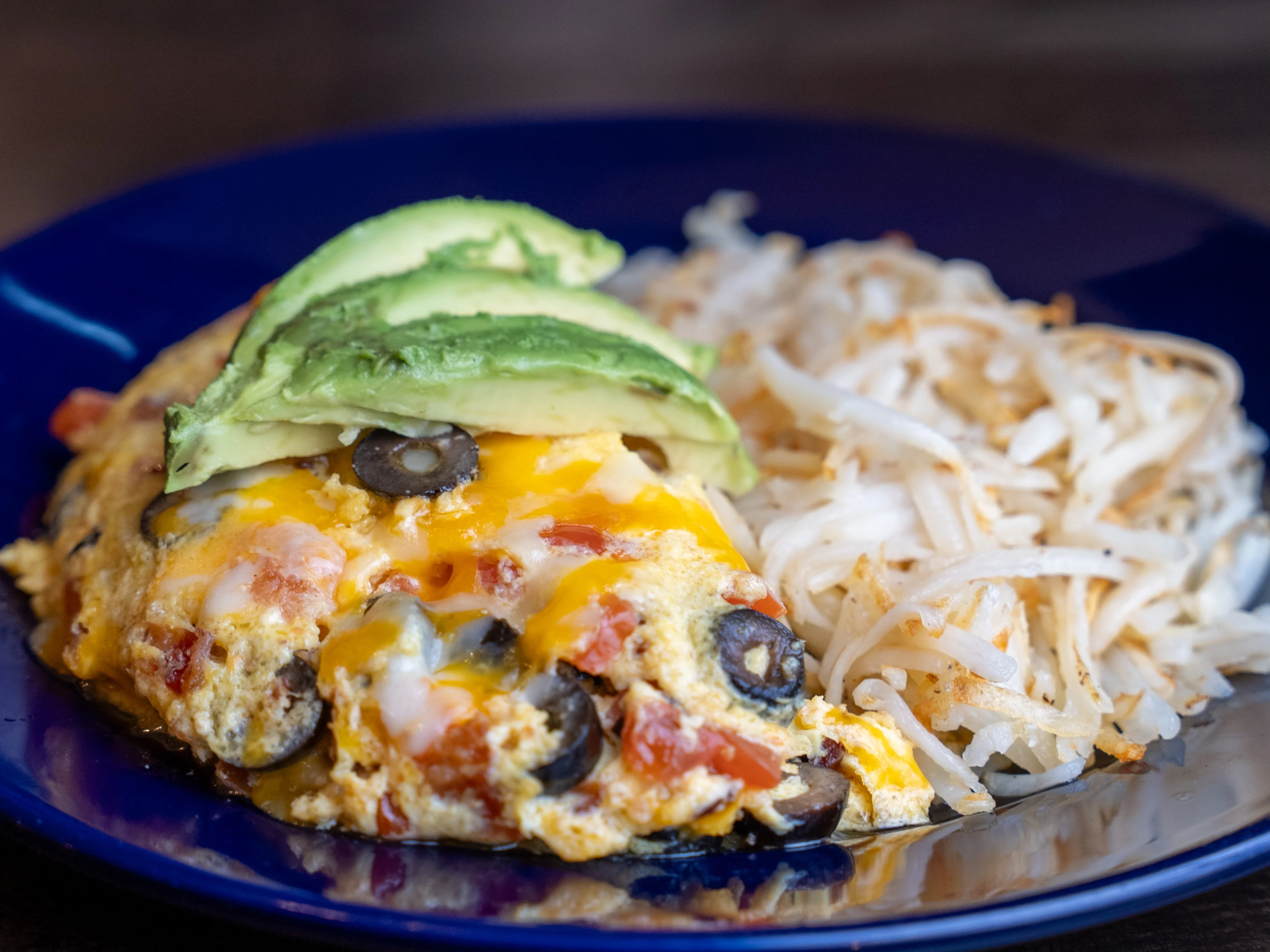 Delicious Mexican huevos rancheros with avocado slices