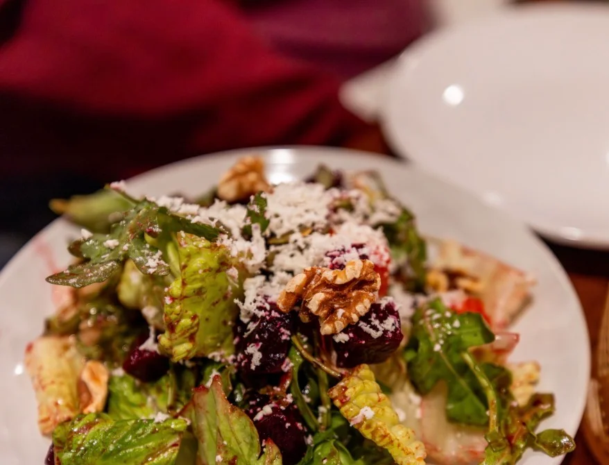 Fresh garden salad with beets and walnuts