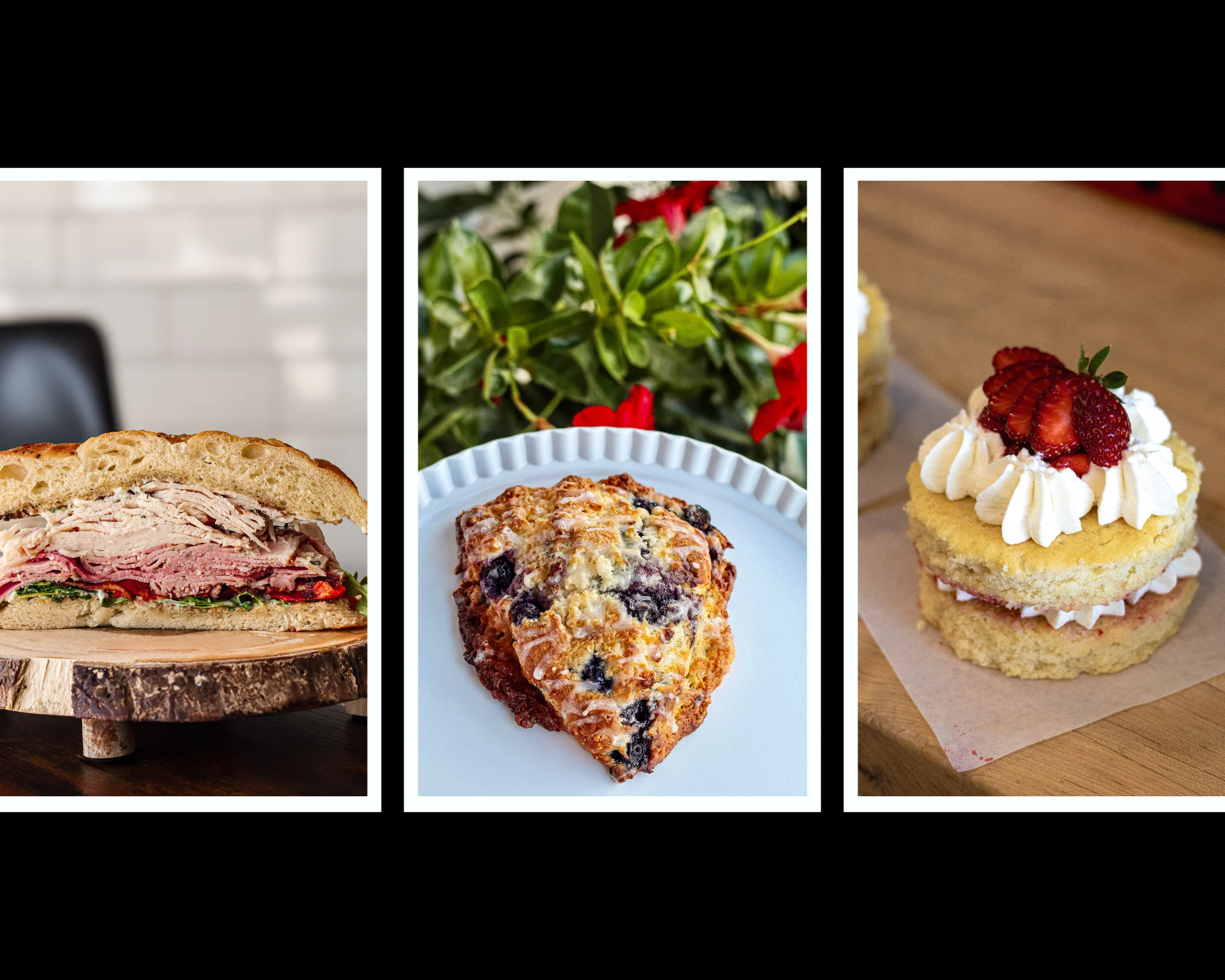 Gourmet deli sandwich with layers of meats on rustic wood board