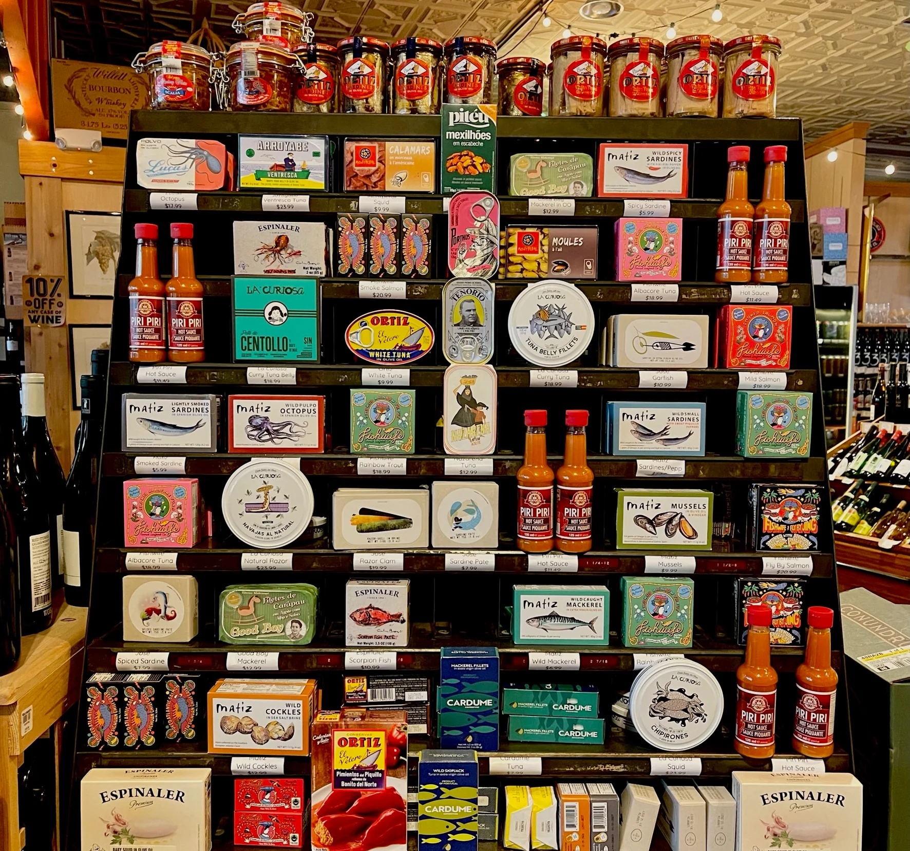 A three-foot tall display of tinned fished with elegant artwork from around the globe