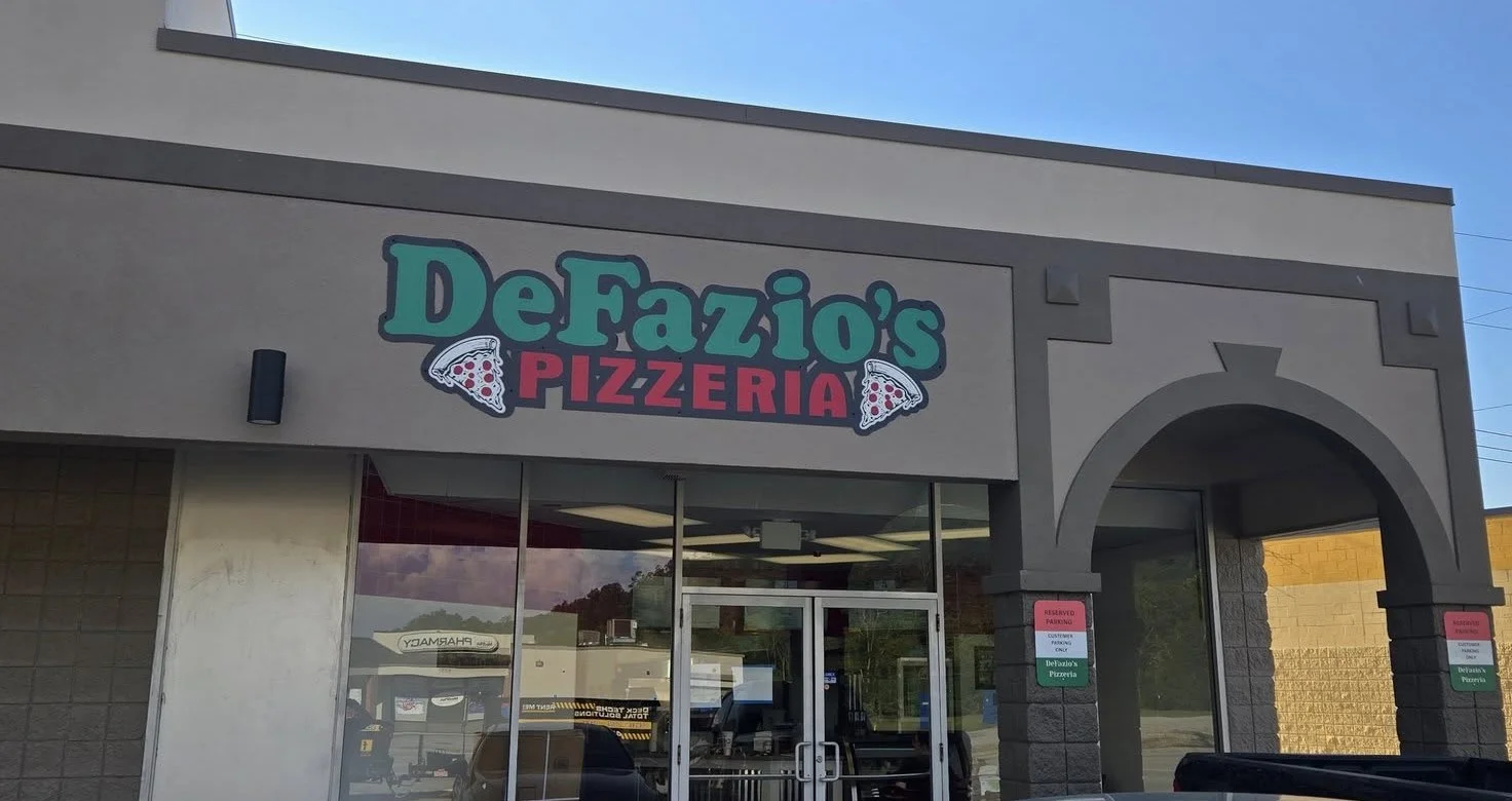 Exterior view of DeFazio's Pizzeria with vibrant signage