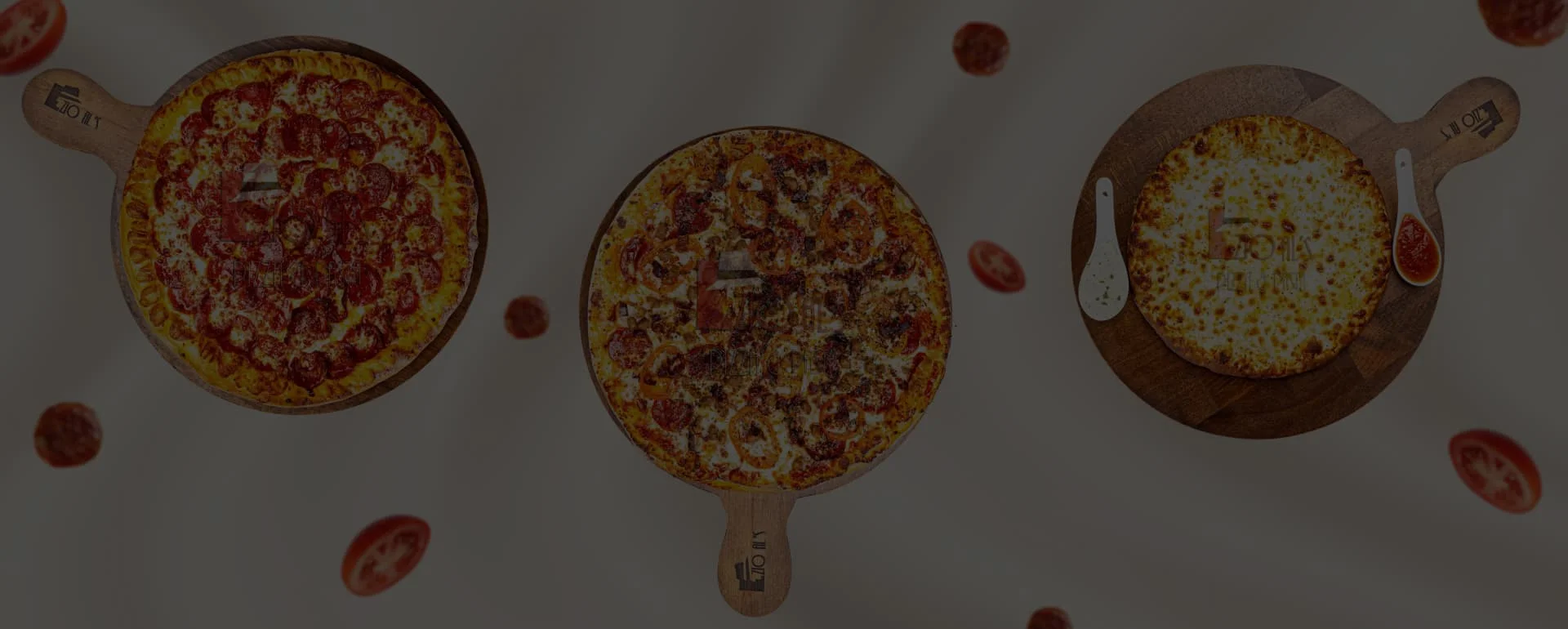 Three delicious pizzas on wooden boards, showcasing classic Italian flavors