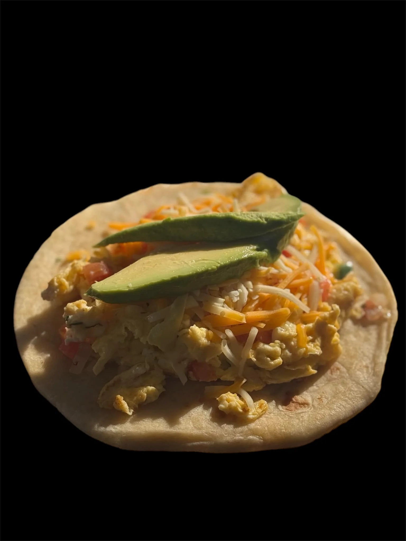 Breakfast taco with scrambled eggs and avocado