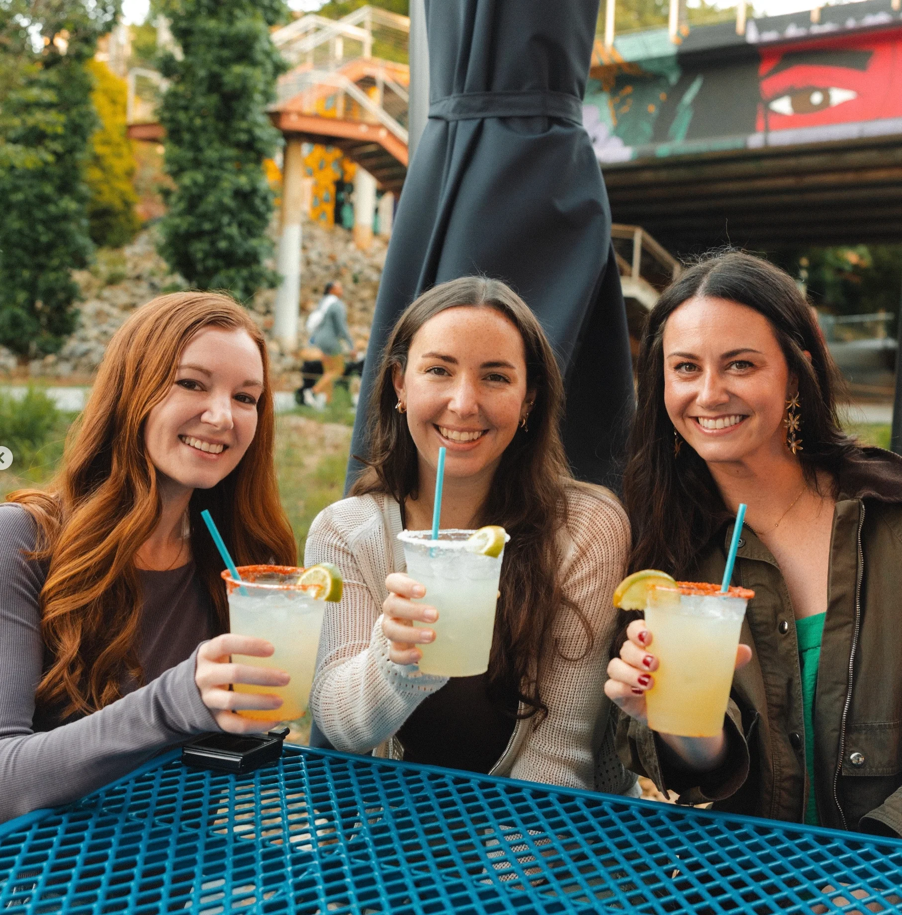Young adults enjoying a drink and the ease of indoor outdoor experience at CHIRINGA O4Wennjo