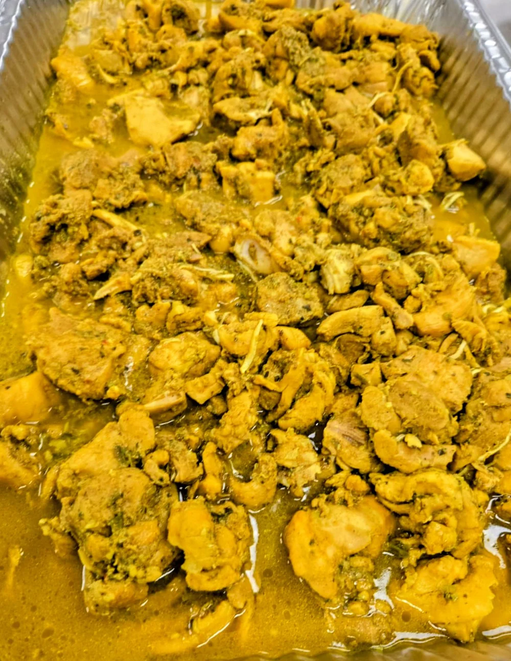 Savory Indian chicken curry in a serving tray