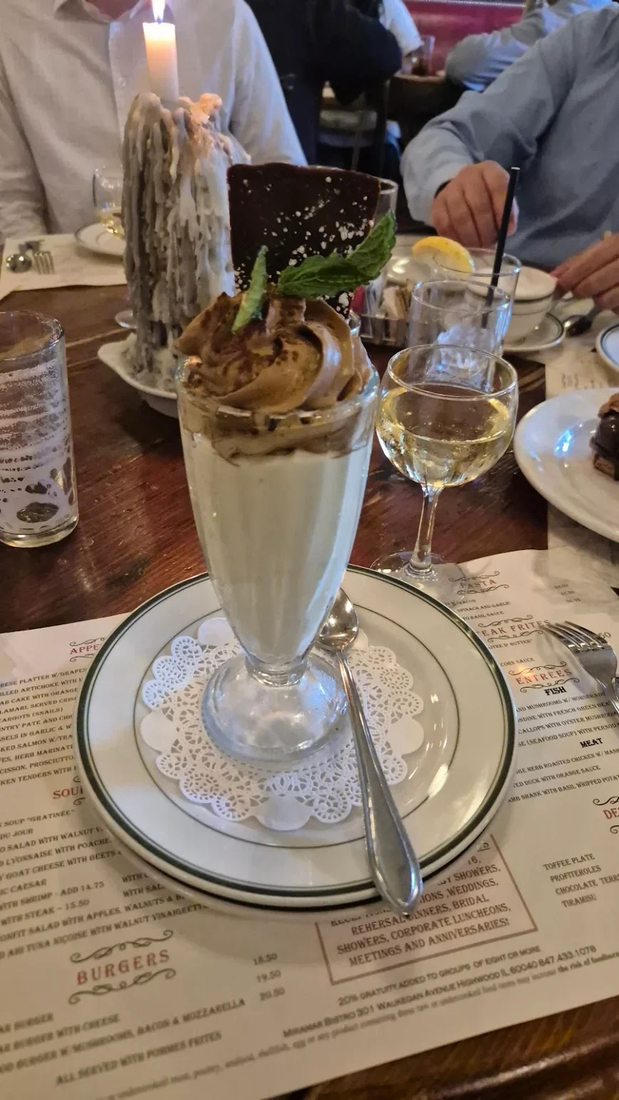 Decadent dessert parfait with chocolate and mint garnish