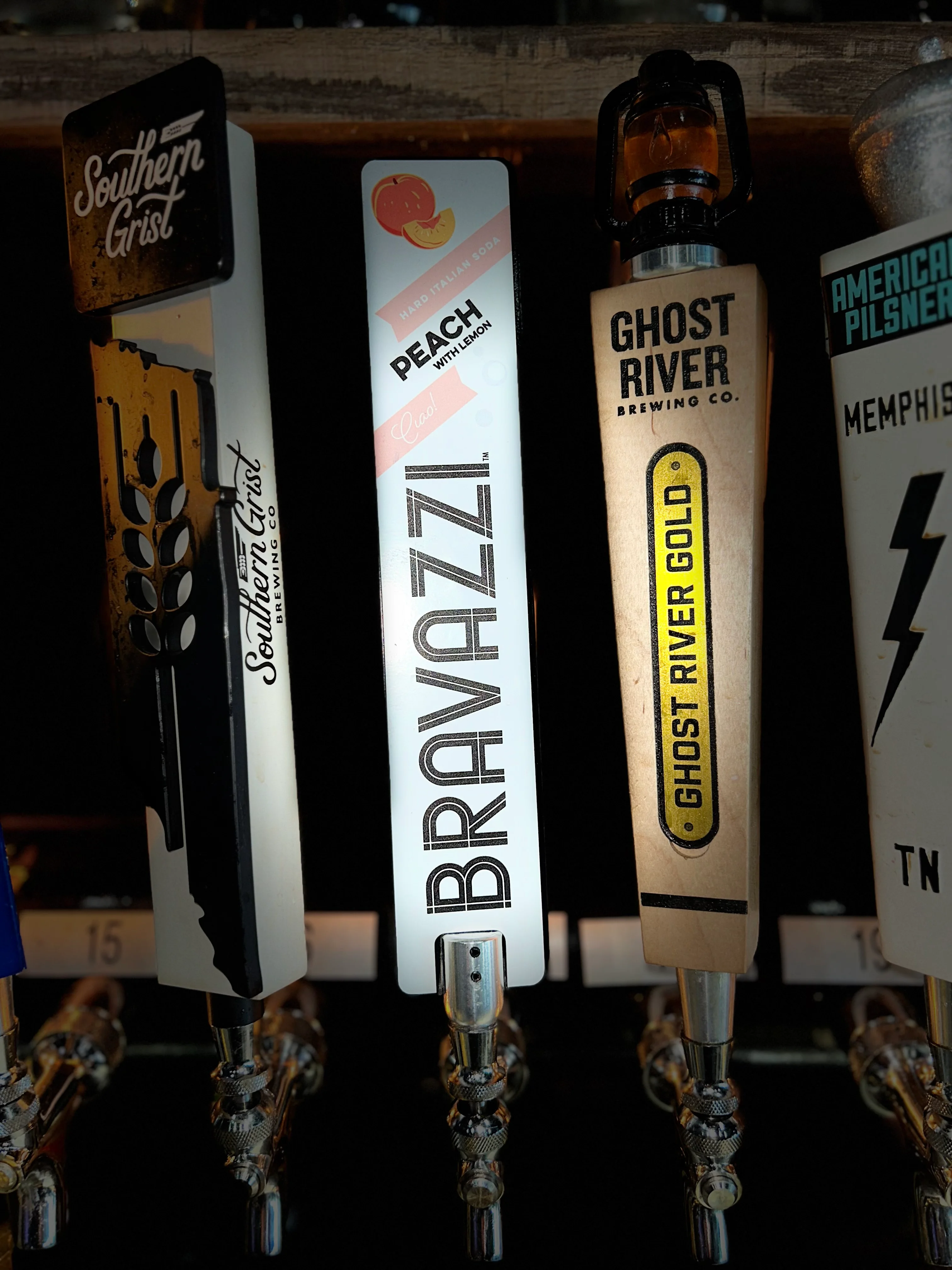 Craft beer taps featuring Southern Grist and Ghost River Brewing