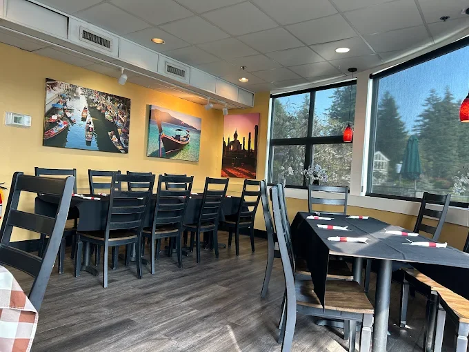 Cozy restaurant interior with vibrant artwork and natural light