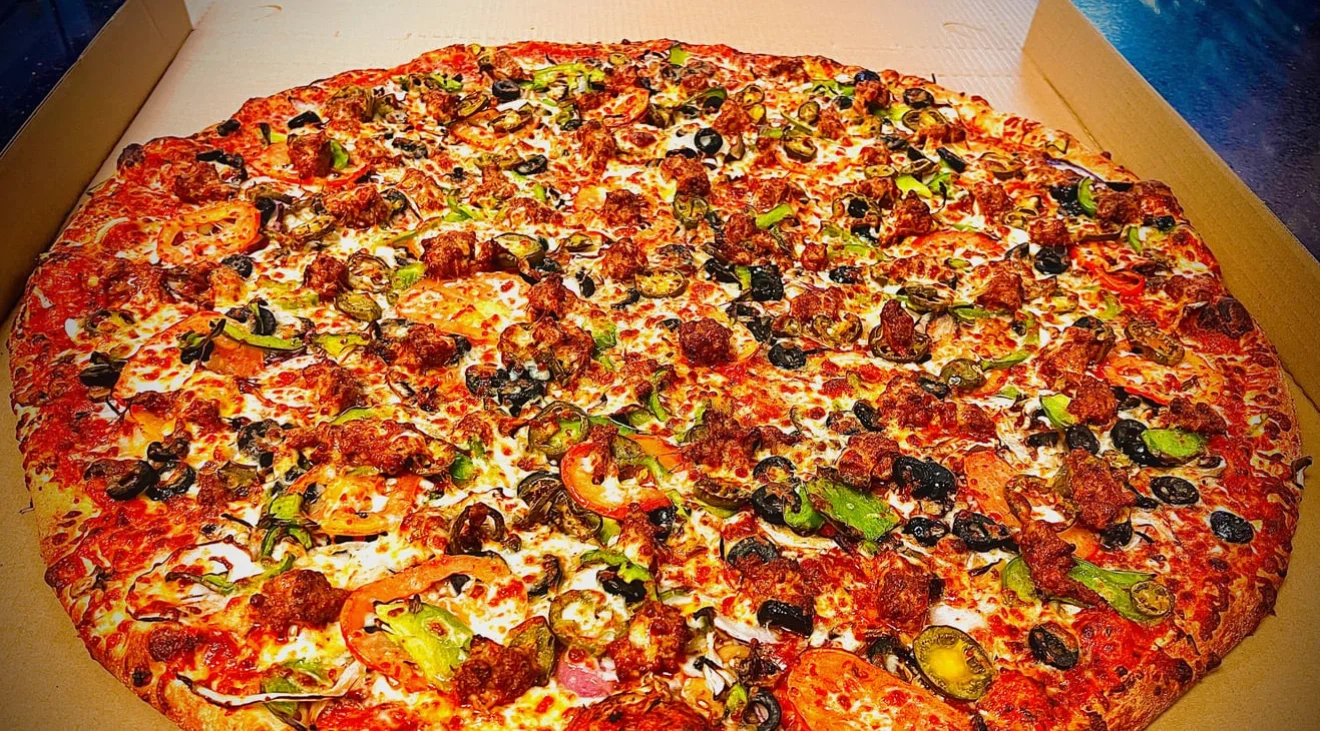 Loaded meat lover's pizza with fresh toppings