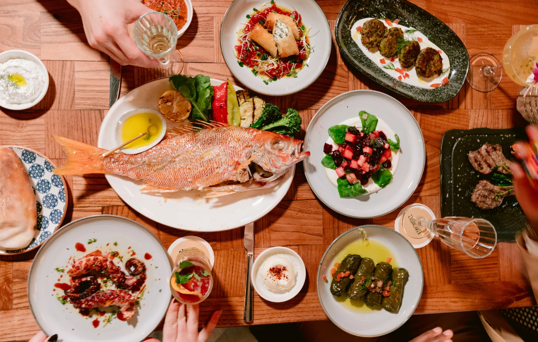 Mediterranean grilled fish platter with assorted sides