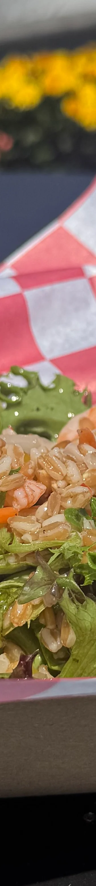 Shrimp salad bowl with fresh greens and toppings