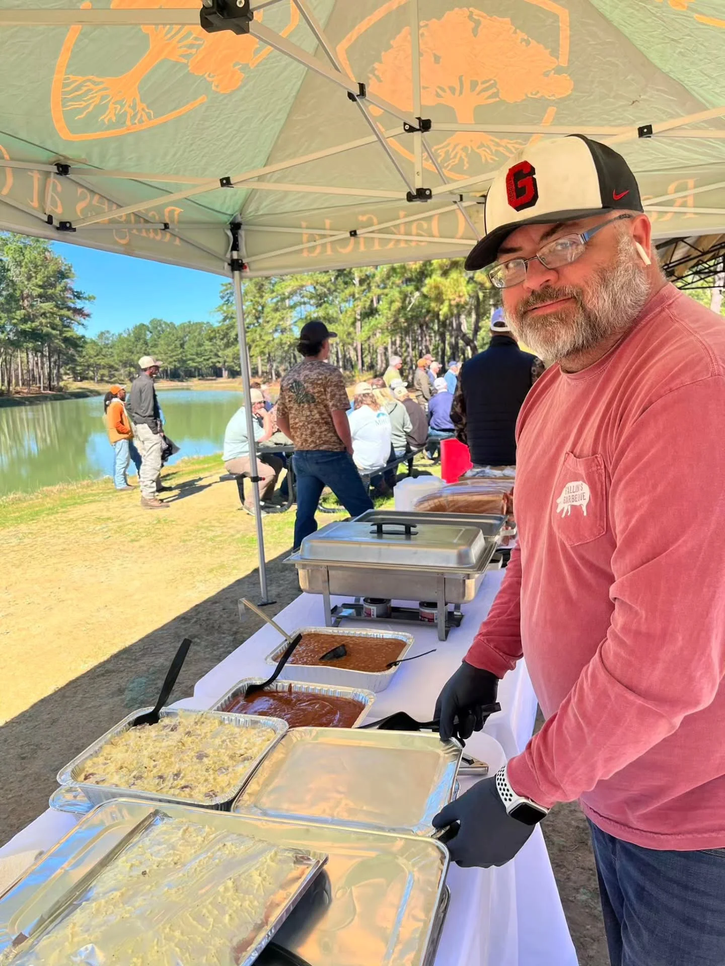 Catering setup with barbecue dishes at an outdoor event