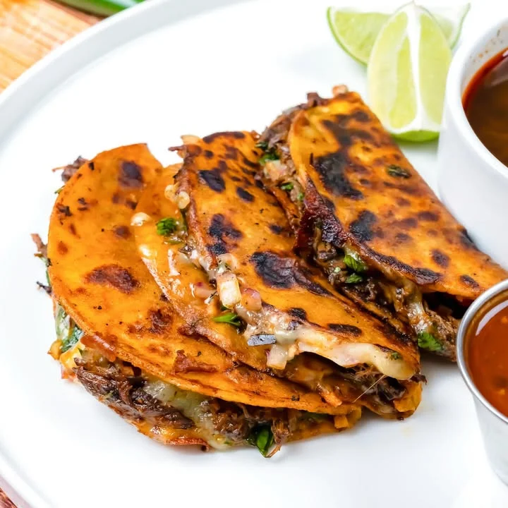 Crispy Mexican quesabirria tacos with cheese