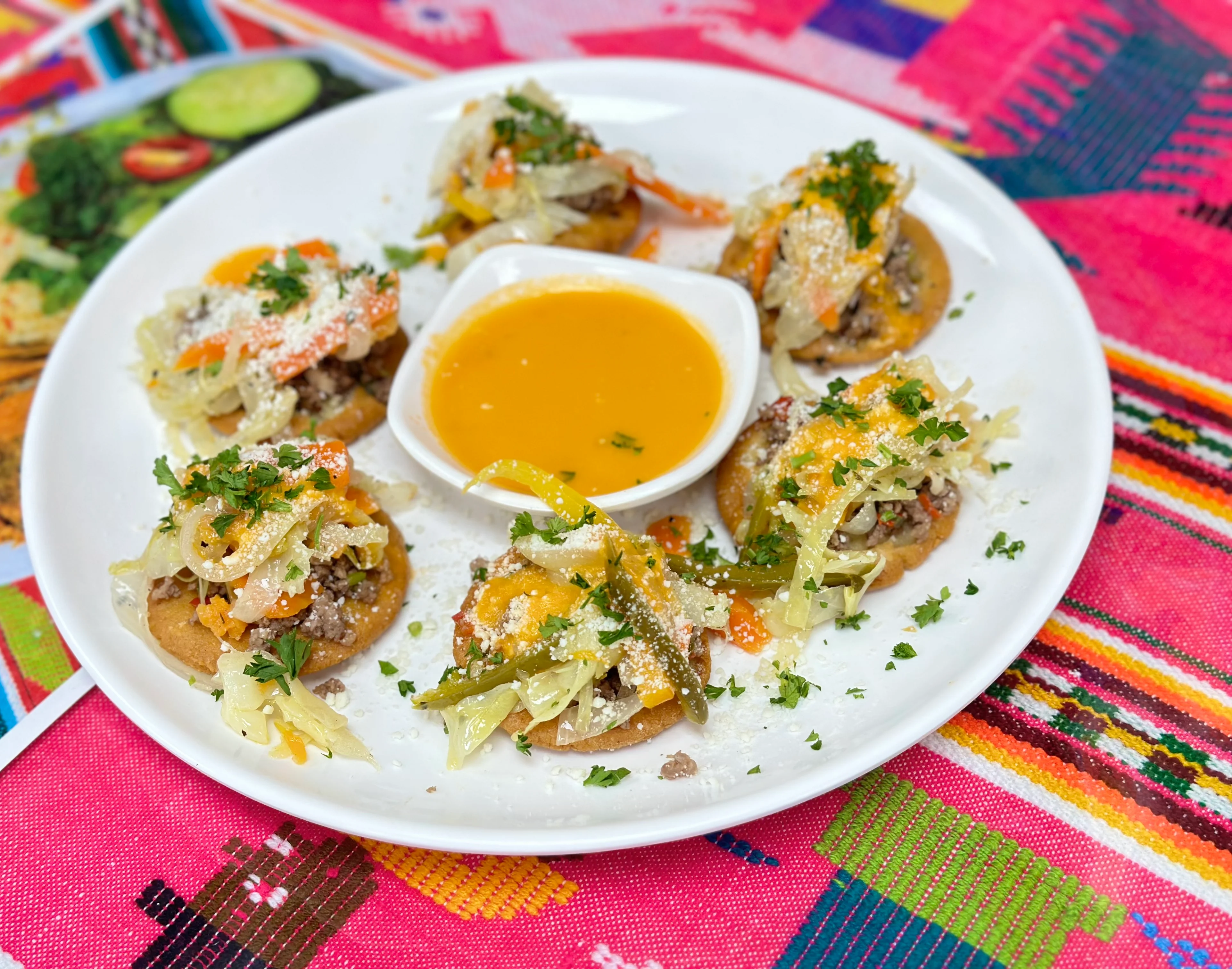 Mexican sopes topped with meat and vegetables