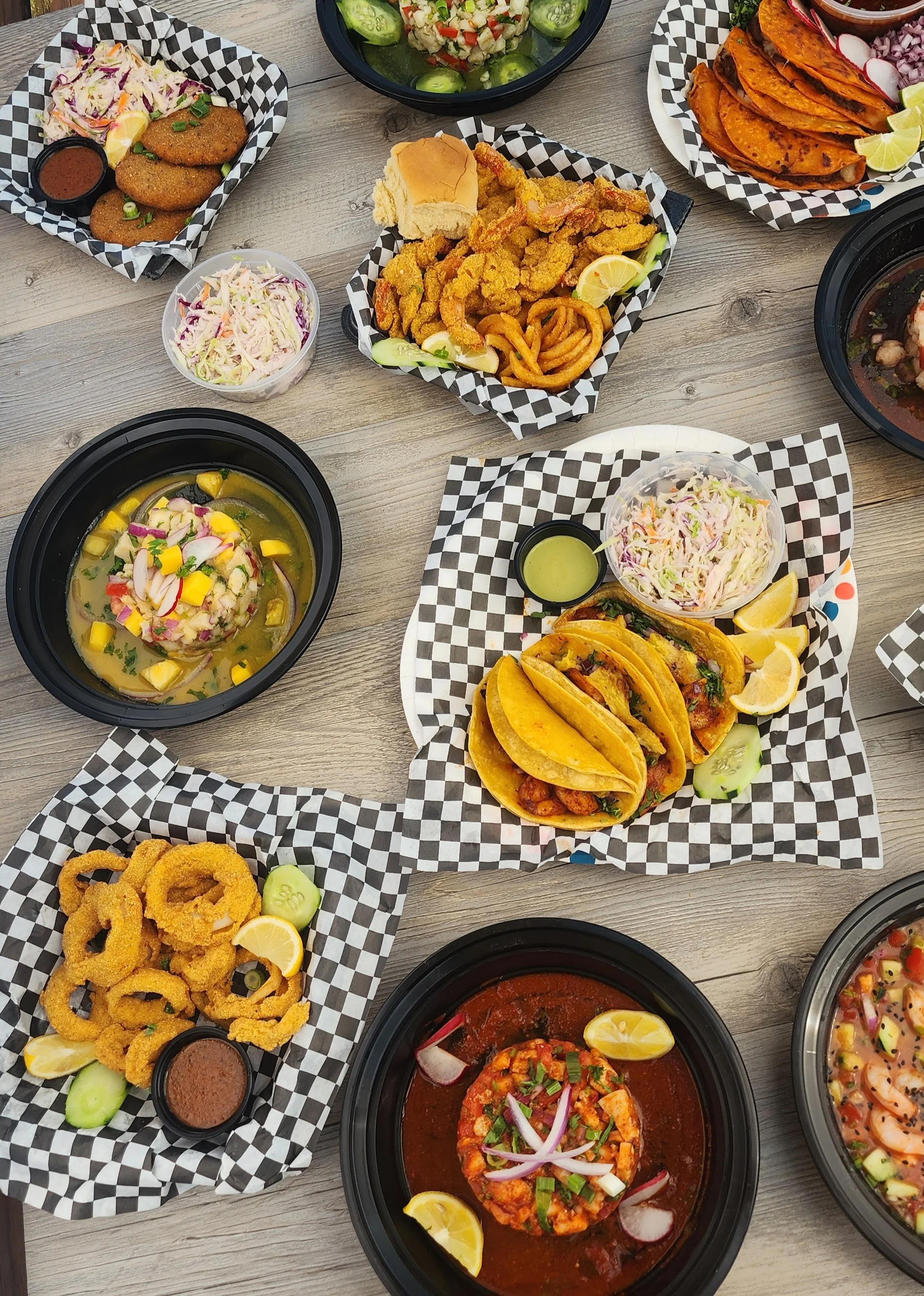 Colorful Mexican seafood platter with tacos and ceviche