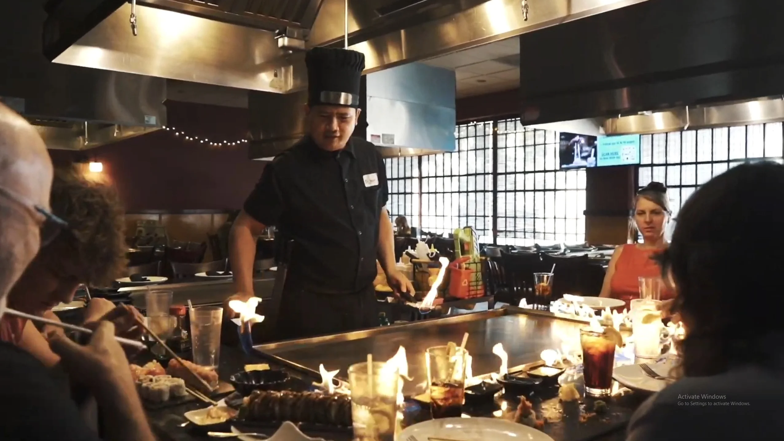 Hibachi chef cooking at the grill in front of guests at Mahzu East Windsor