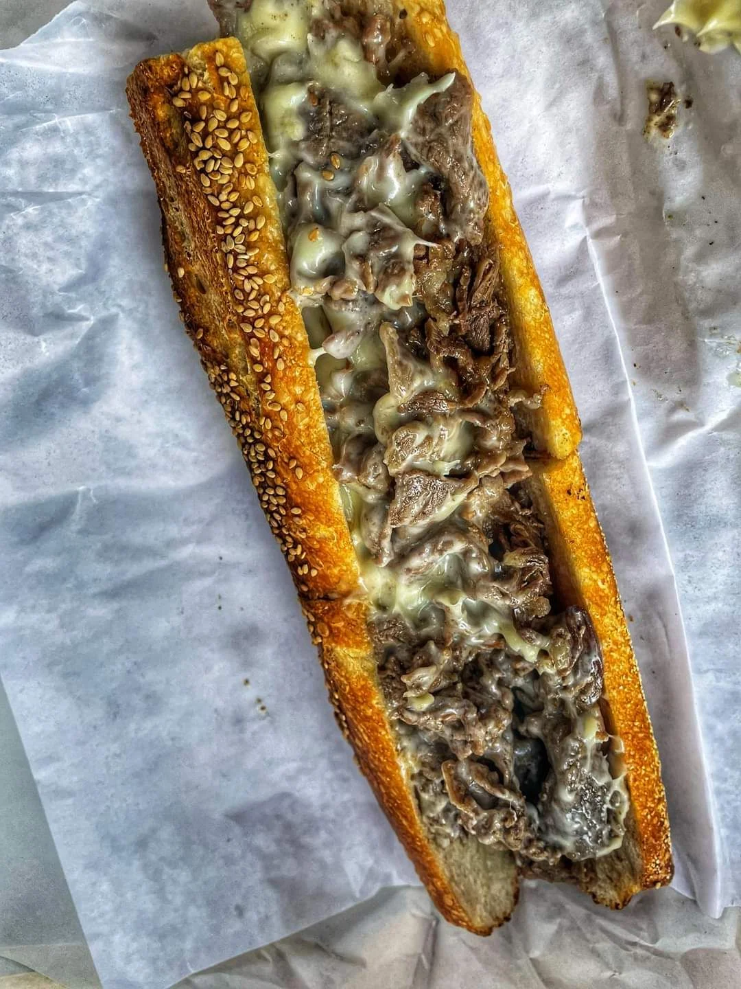 Classic Philly cheesesteak sandwich with melted cheese