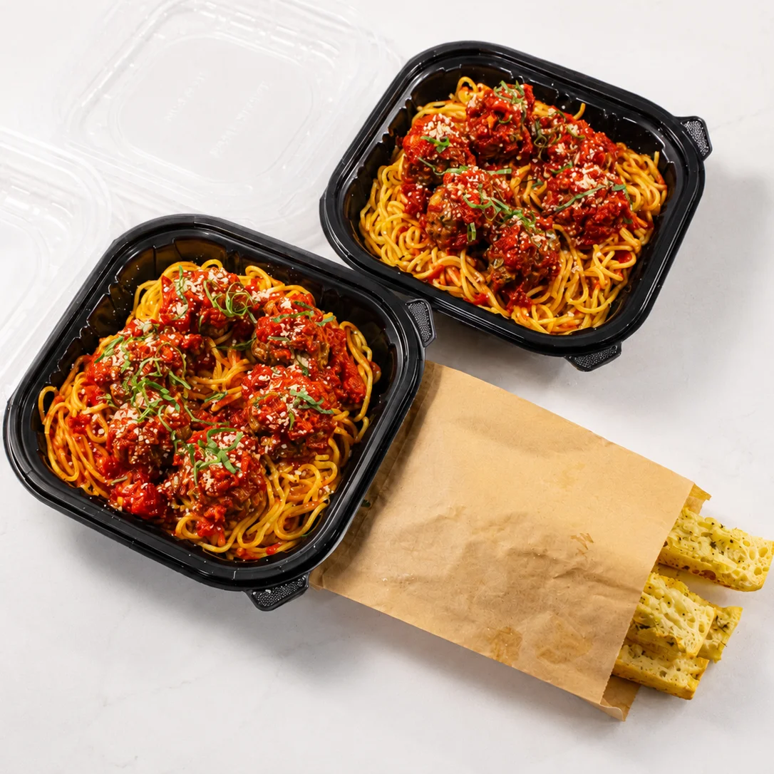 Spaghetti and meatballs in marinara sauce with garlic bread