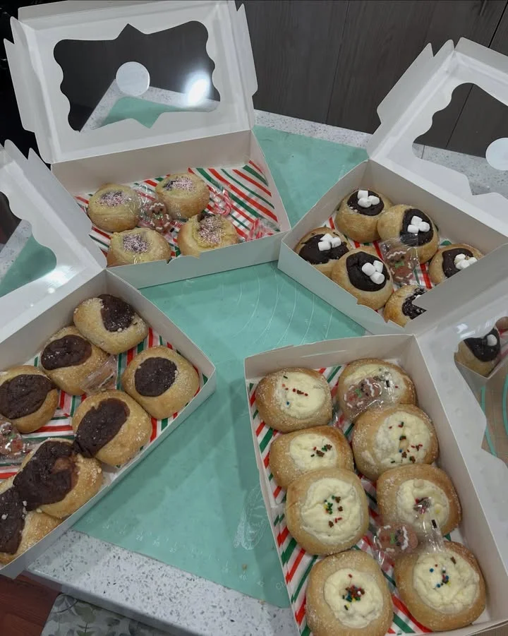 Assorted holiday cookies in festive boxes