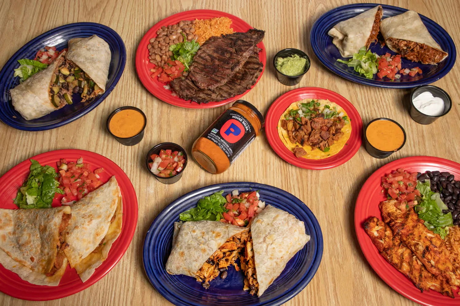 Papalote Salsa Jar surrounded by various dishes