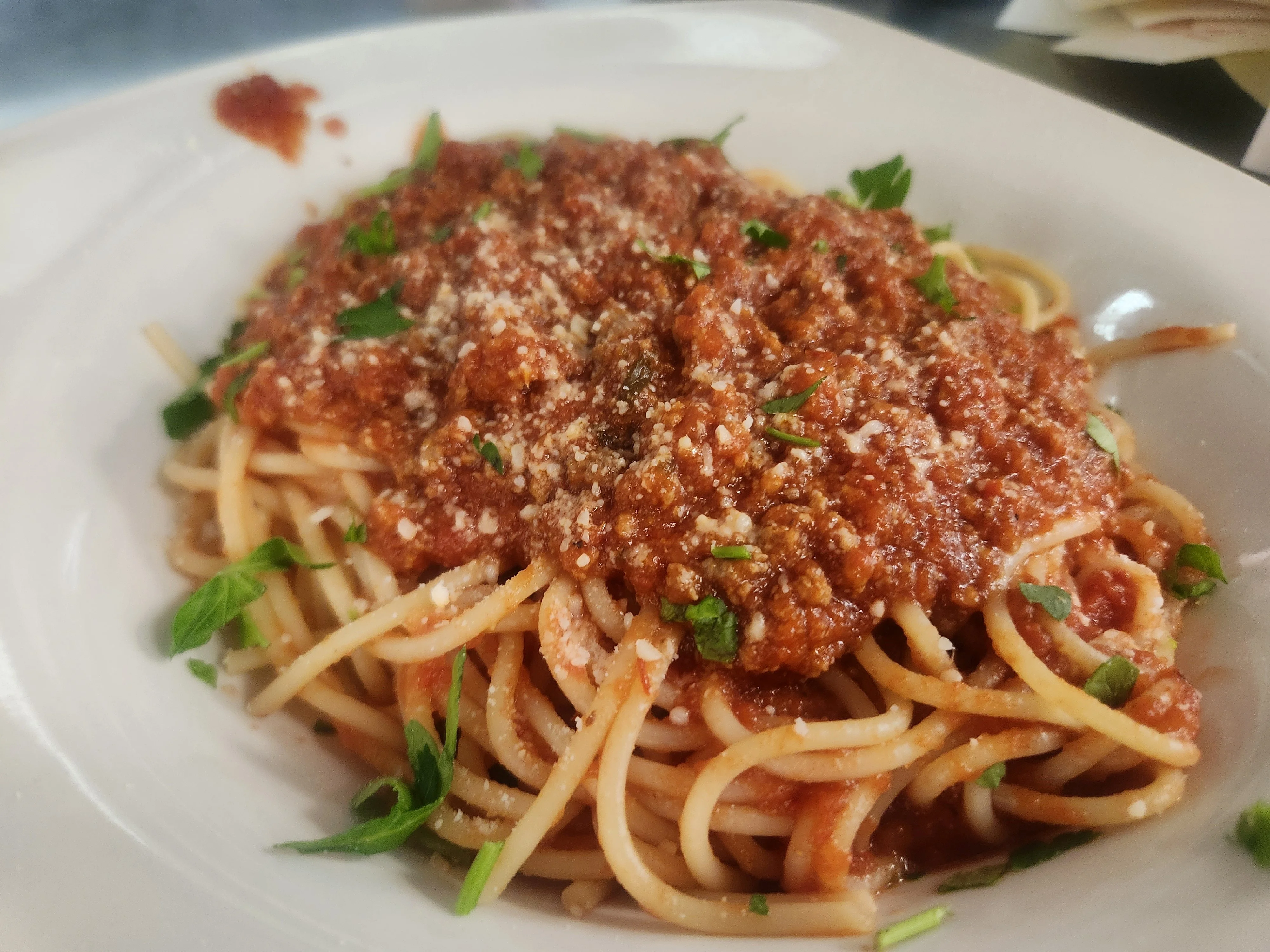 Classic spaghetti with meat sauce and fresh herbs