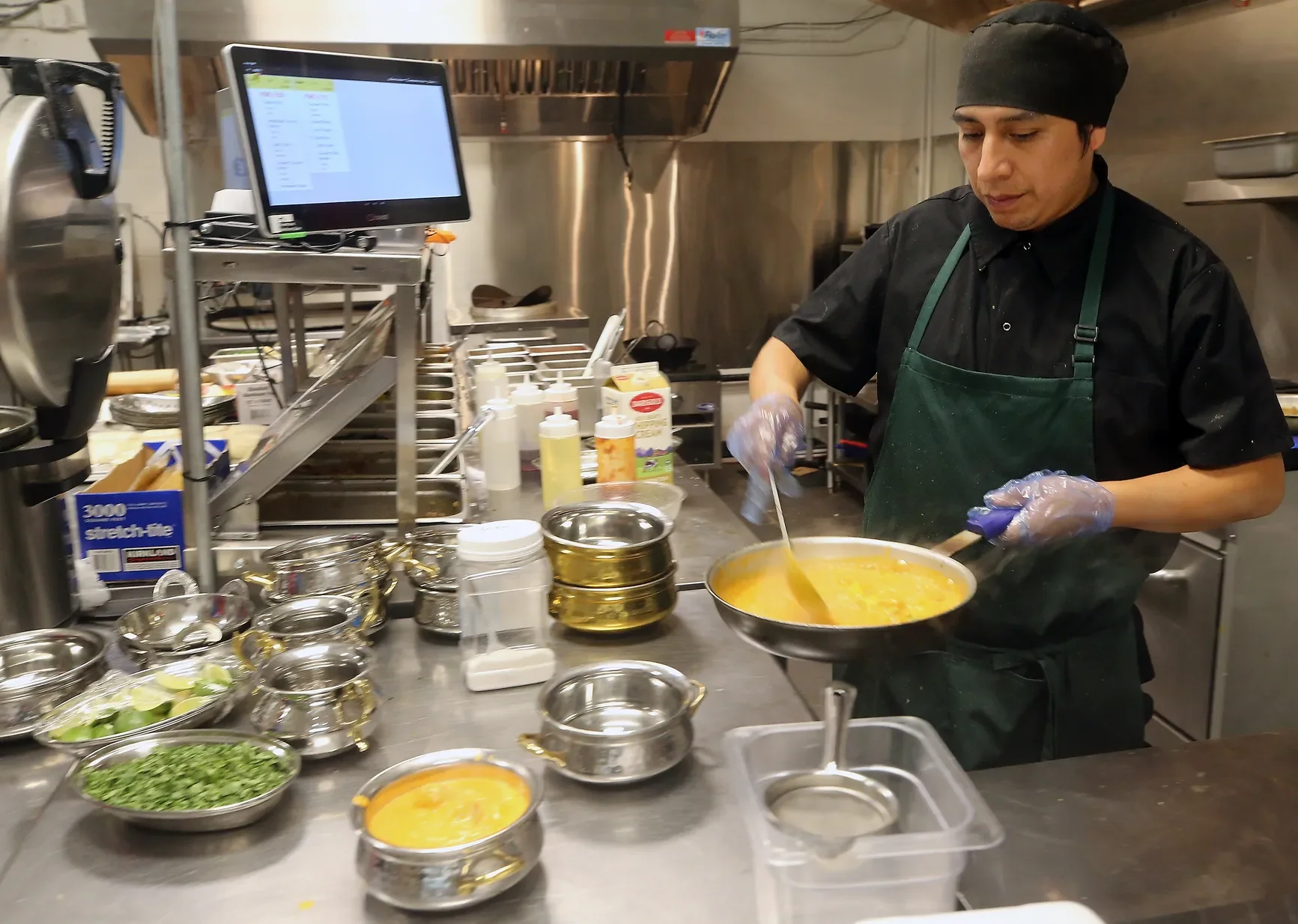 A restaurant chef preparing a dish